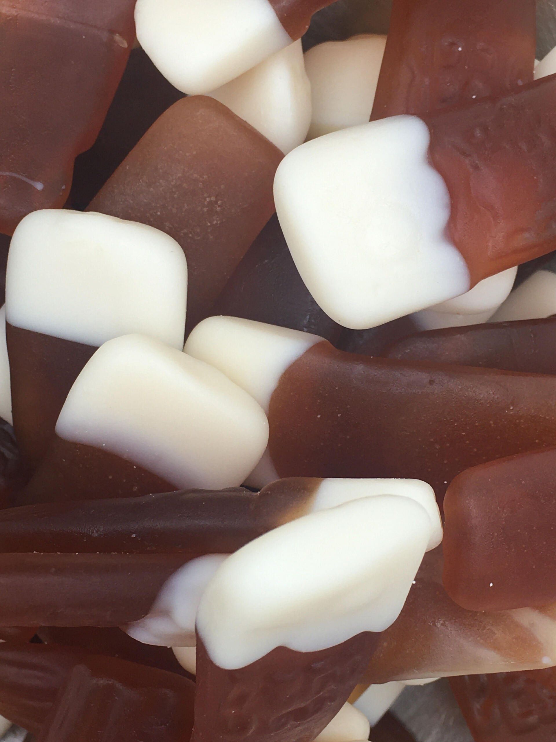 A close up of a pile of brown and white candy corn
