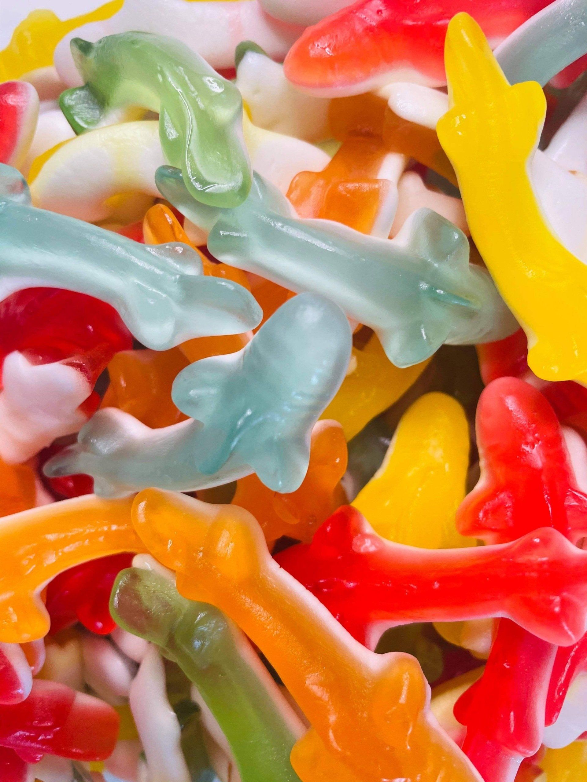 A pile of gummy sharks of different colors
