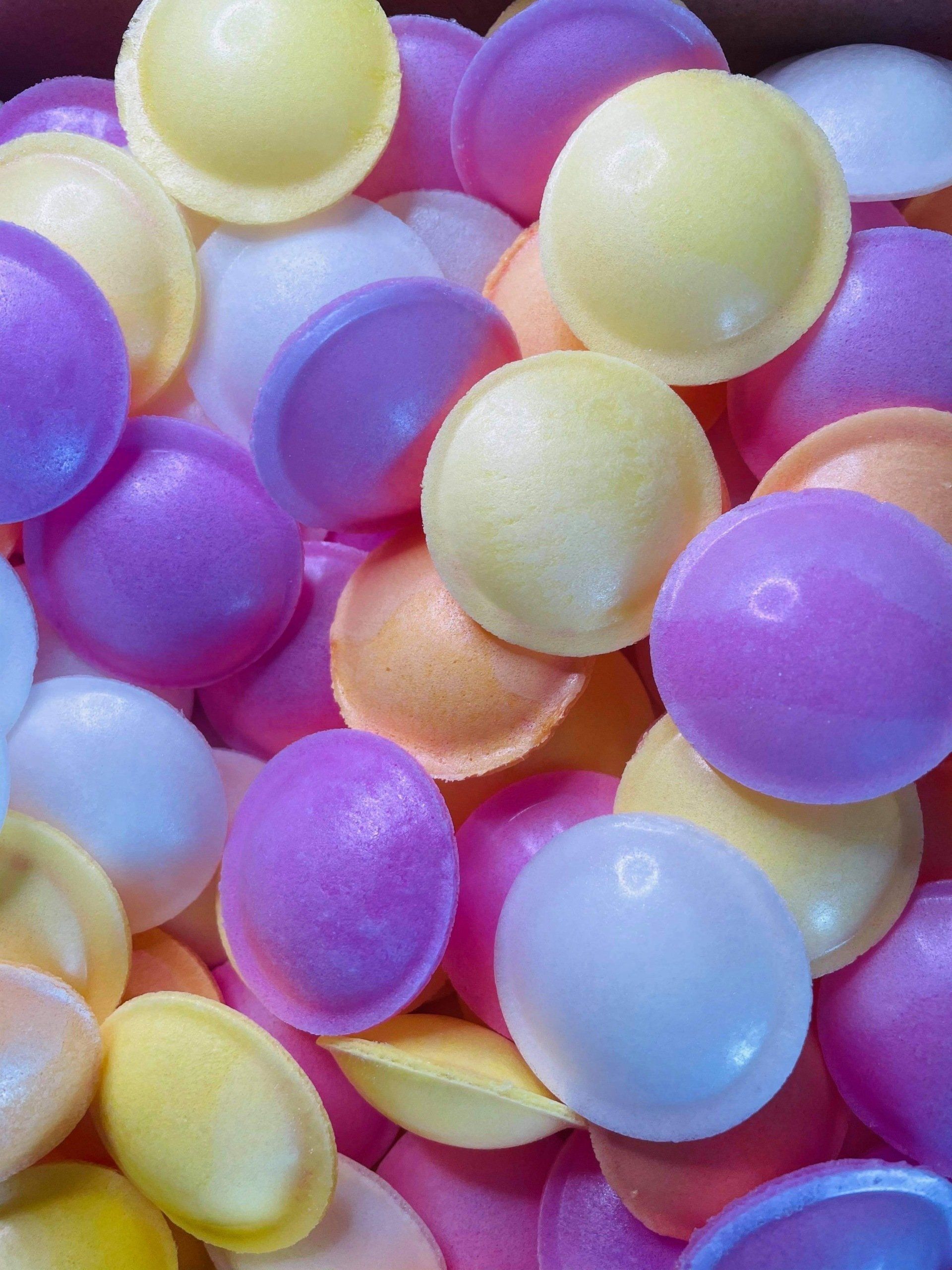 A bunch of colorful balls are stacked on top of each other