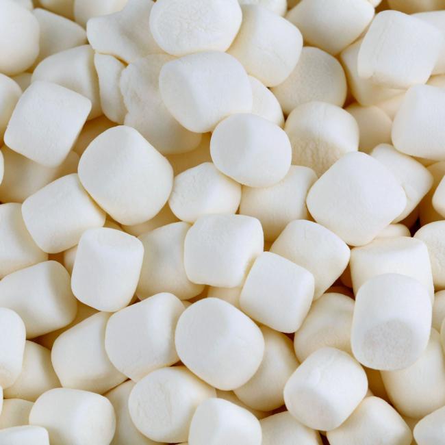 A pile of white marshmallows are stacked on top of each other