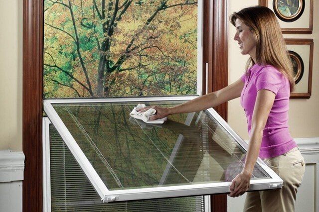 Woman Cleaning Window — Baldwin, MD — J.W. Calvert MFG.