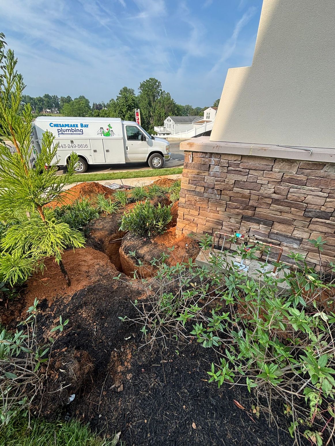 A close up of a stainless steel kitchen sink with a faucet.