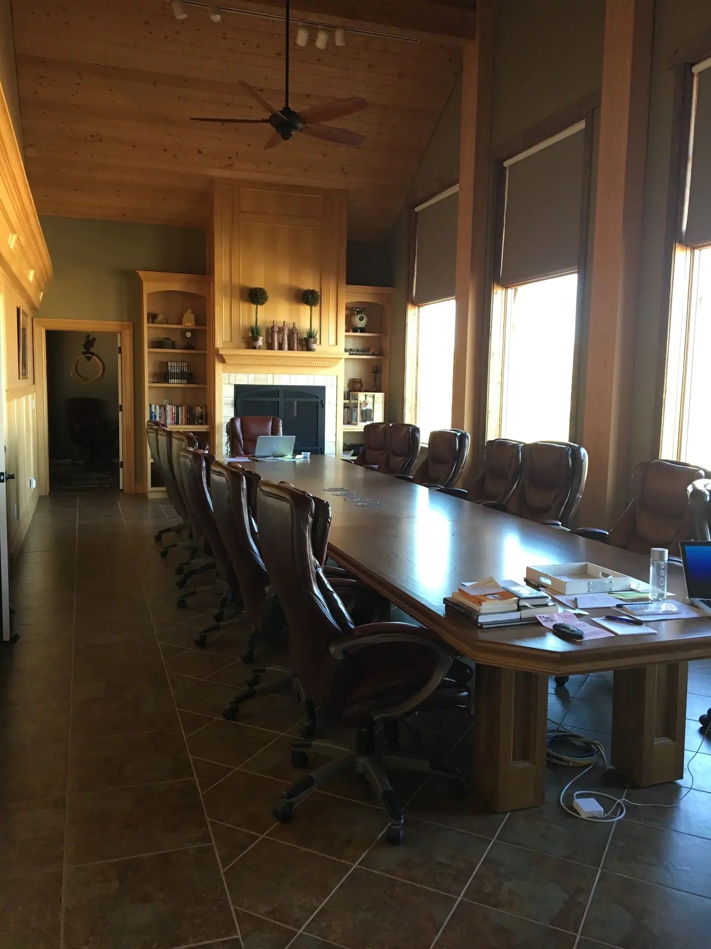 A conference room with a long table and chairs