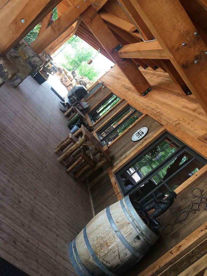 A wooden barrel is sitting in the middle of a wooden room.
