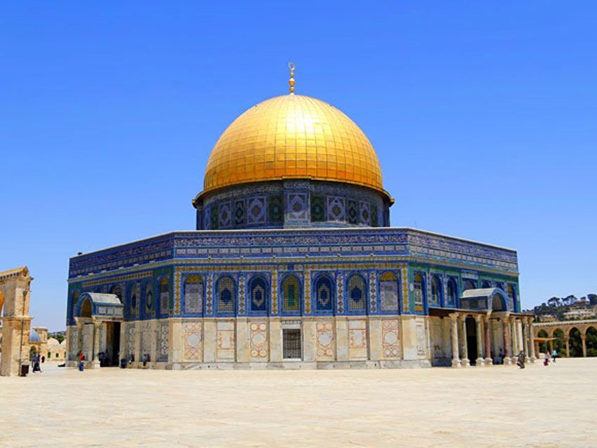 The dome of the rock is a very large building with a gold dome.