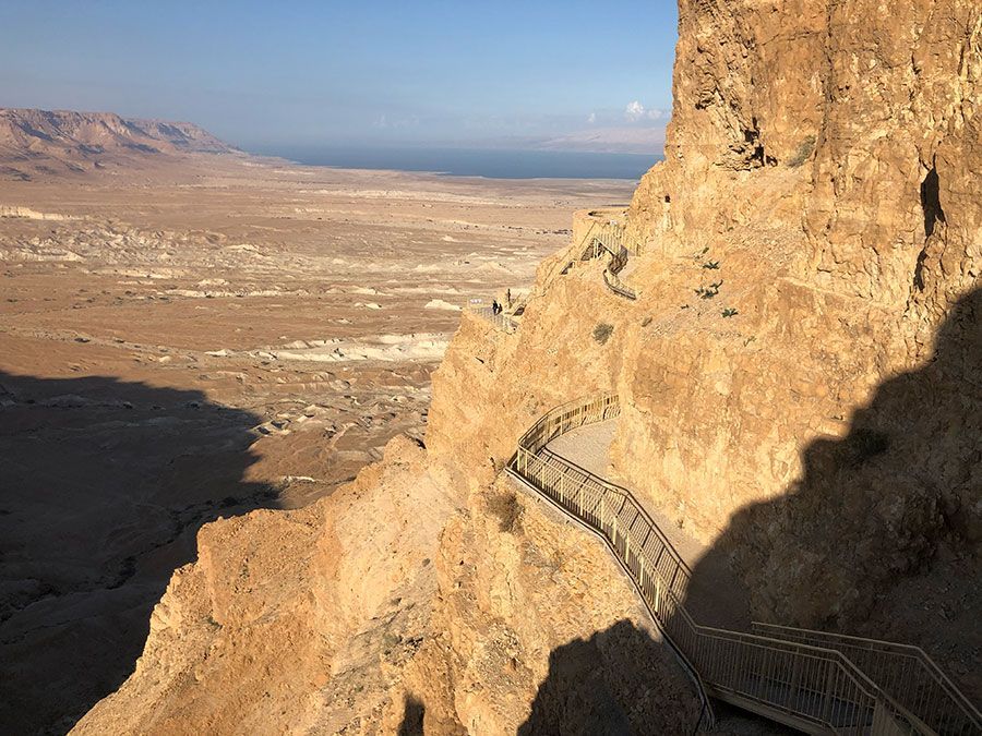 A staircase leading up to the top of a rocky mountain.