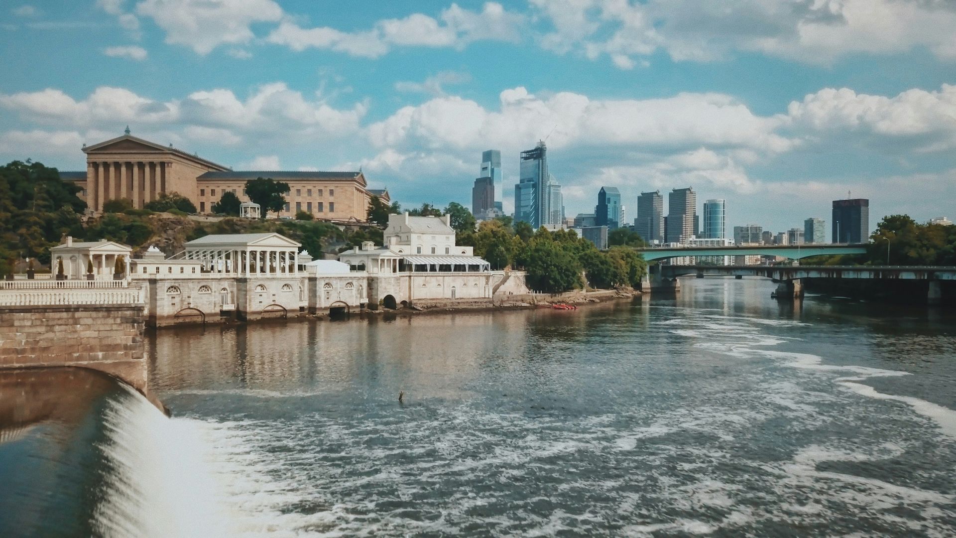 A large body of water with a city skyline in the background.