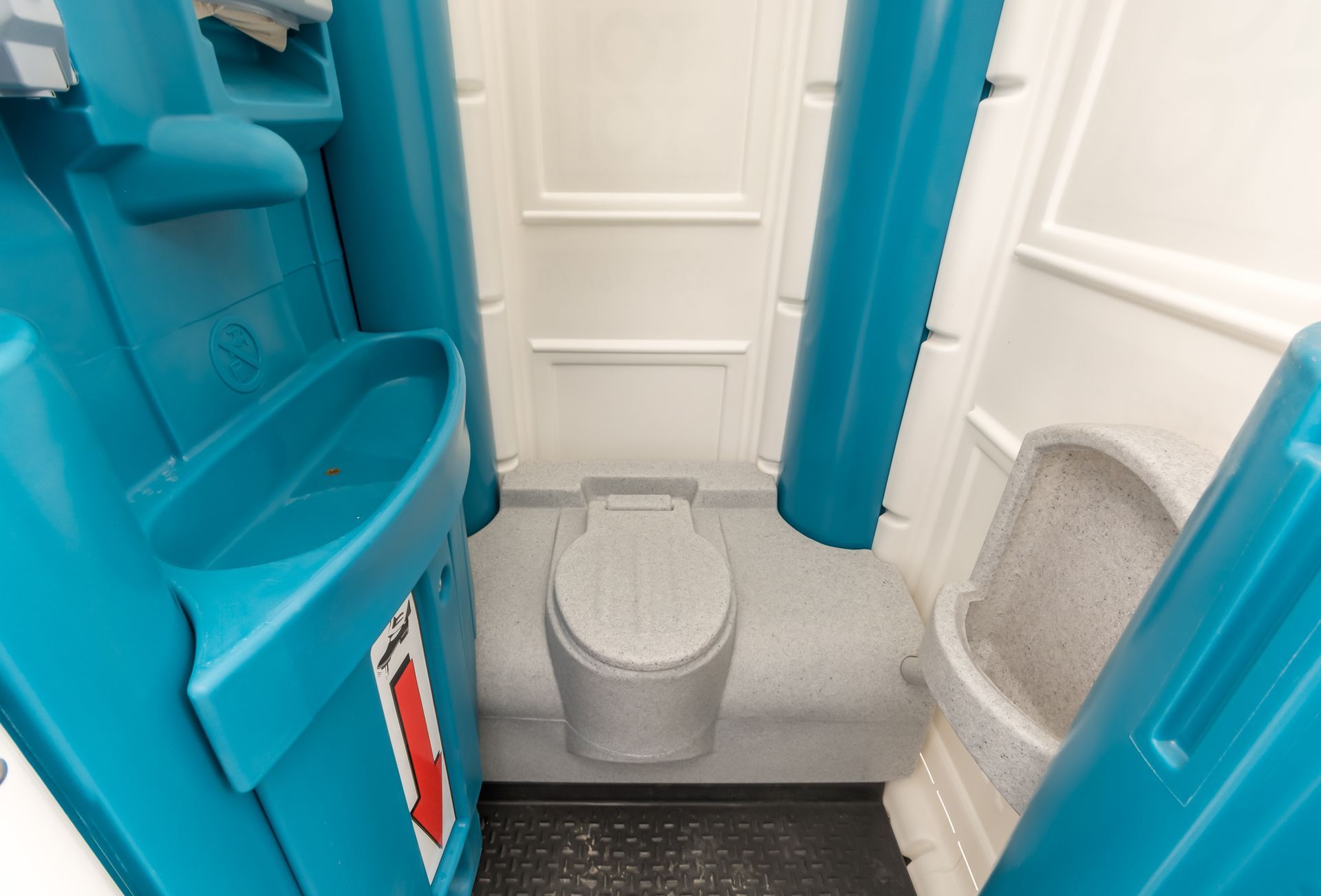 A blue and white portable toilet with a sink and toilet