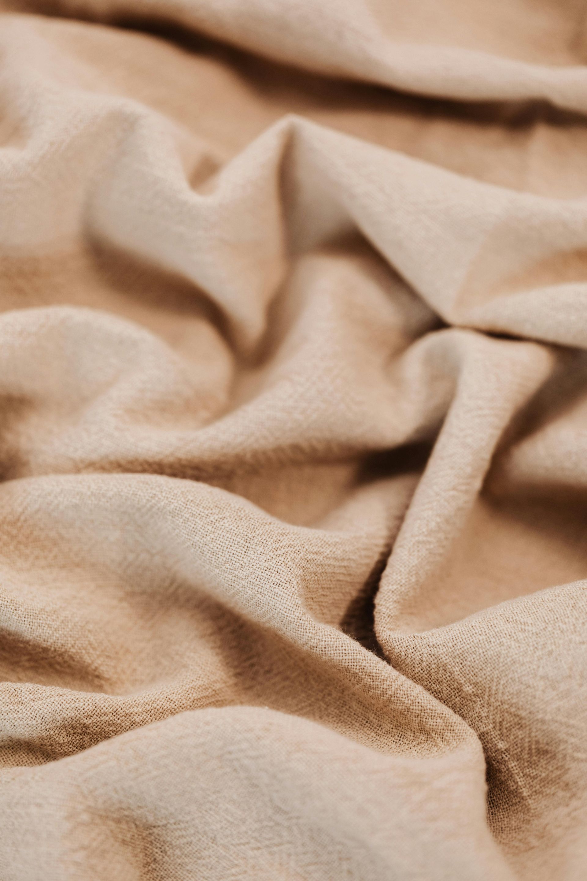 A close up of a piece of tan suede fabric.