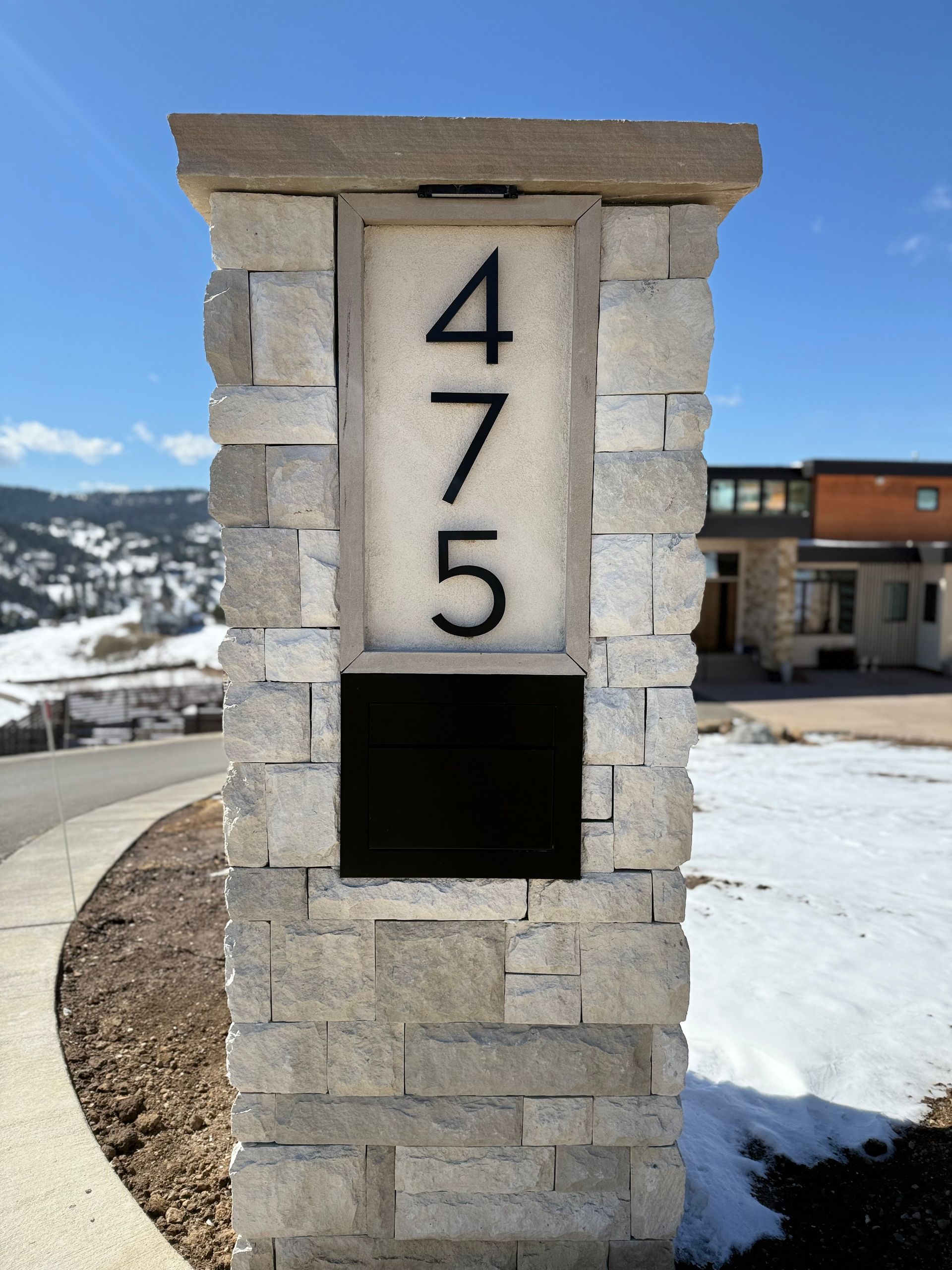 Stone pillar with house number 