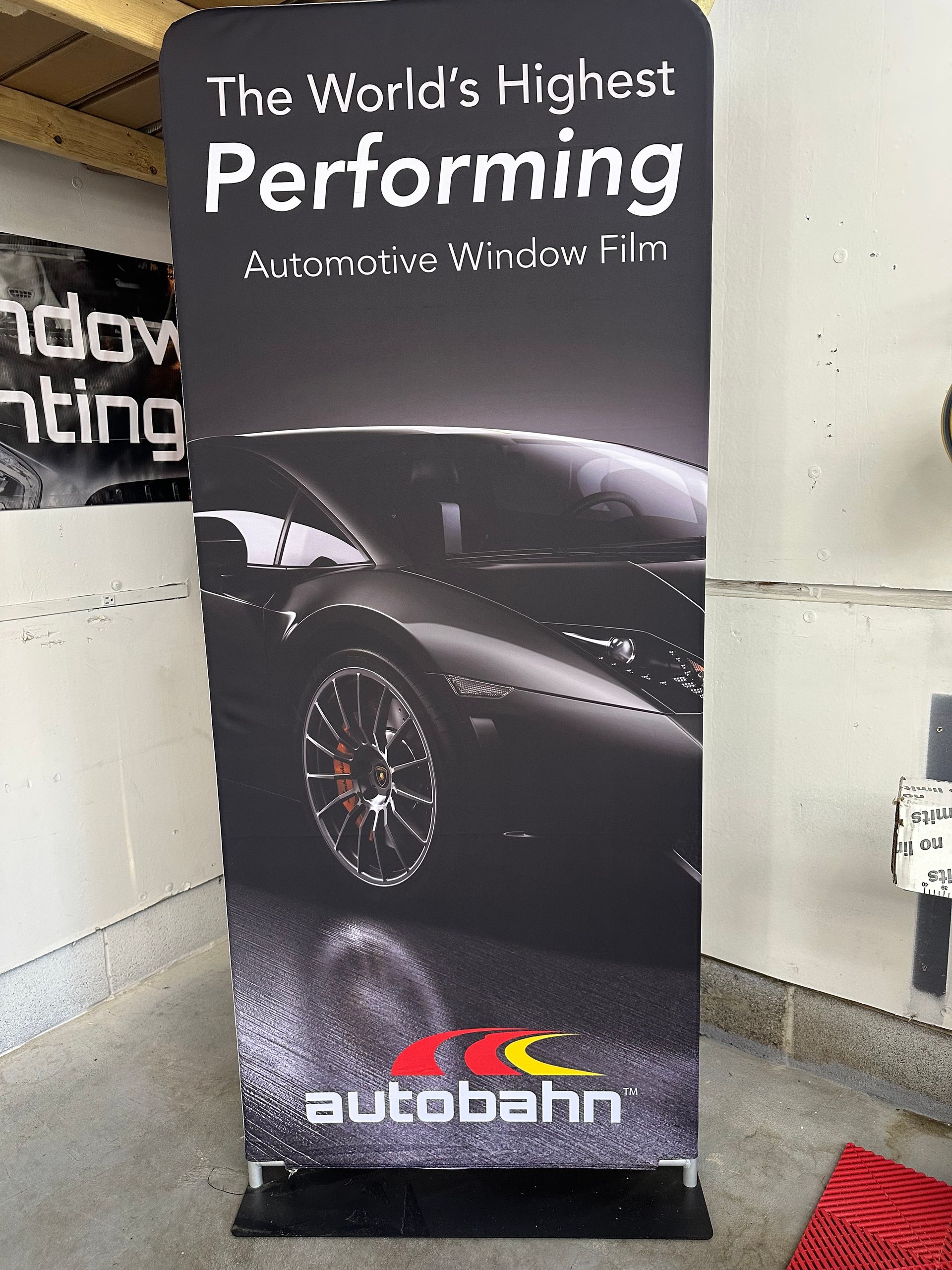 A sign that says the world 's highest performing automotive window film