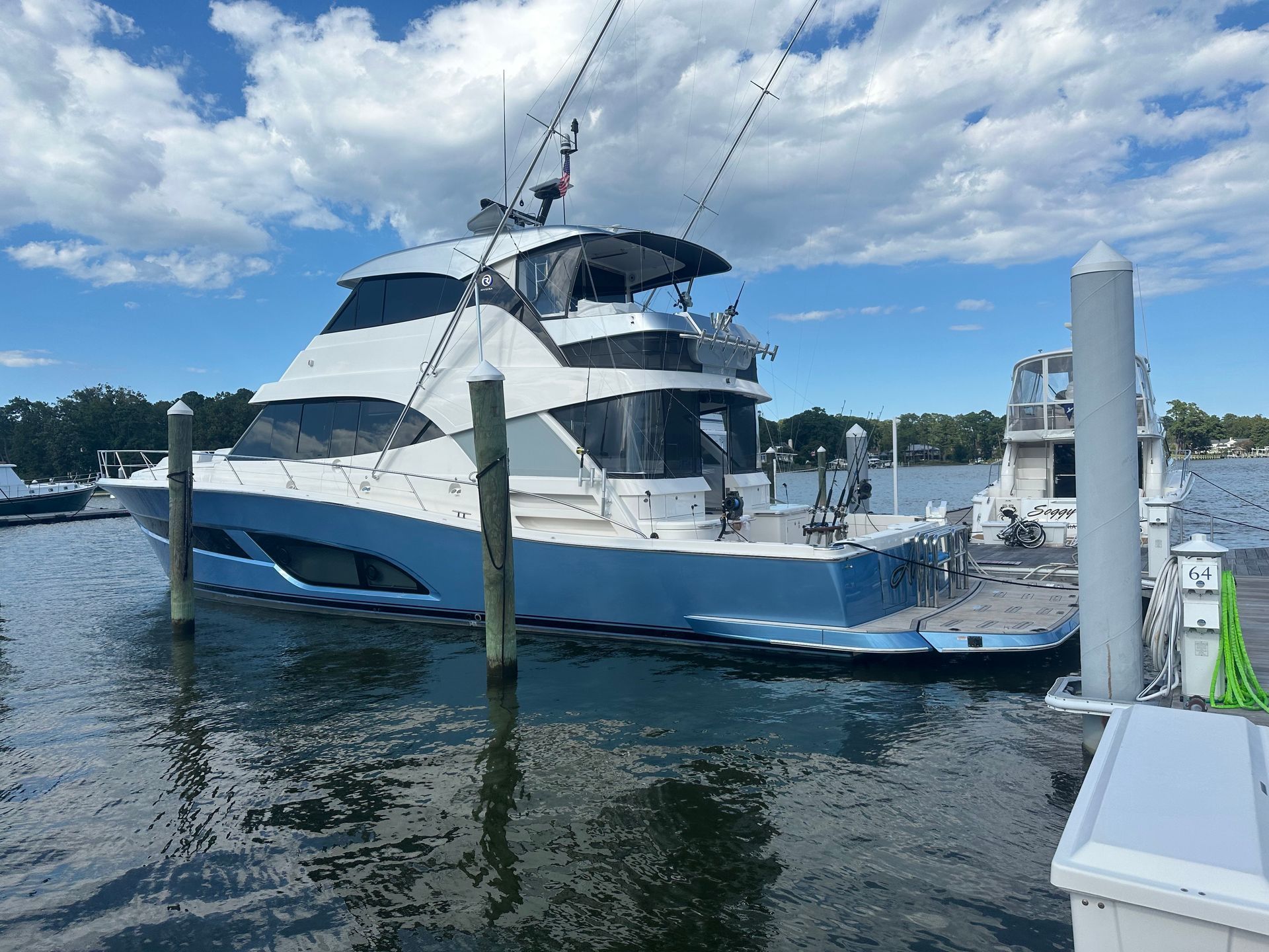 The back of a boat with a table and chairs
