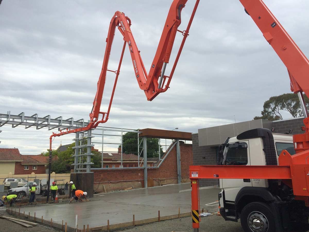 A concrete pump is being used on a construction site