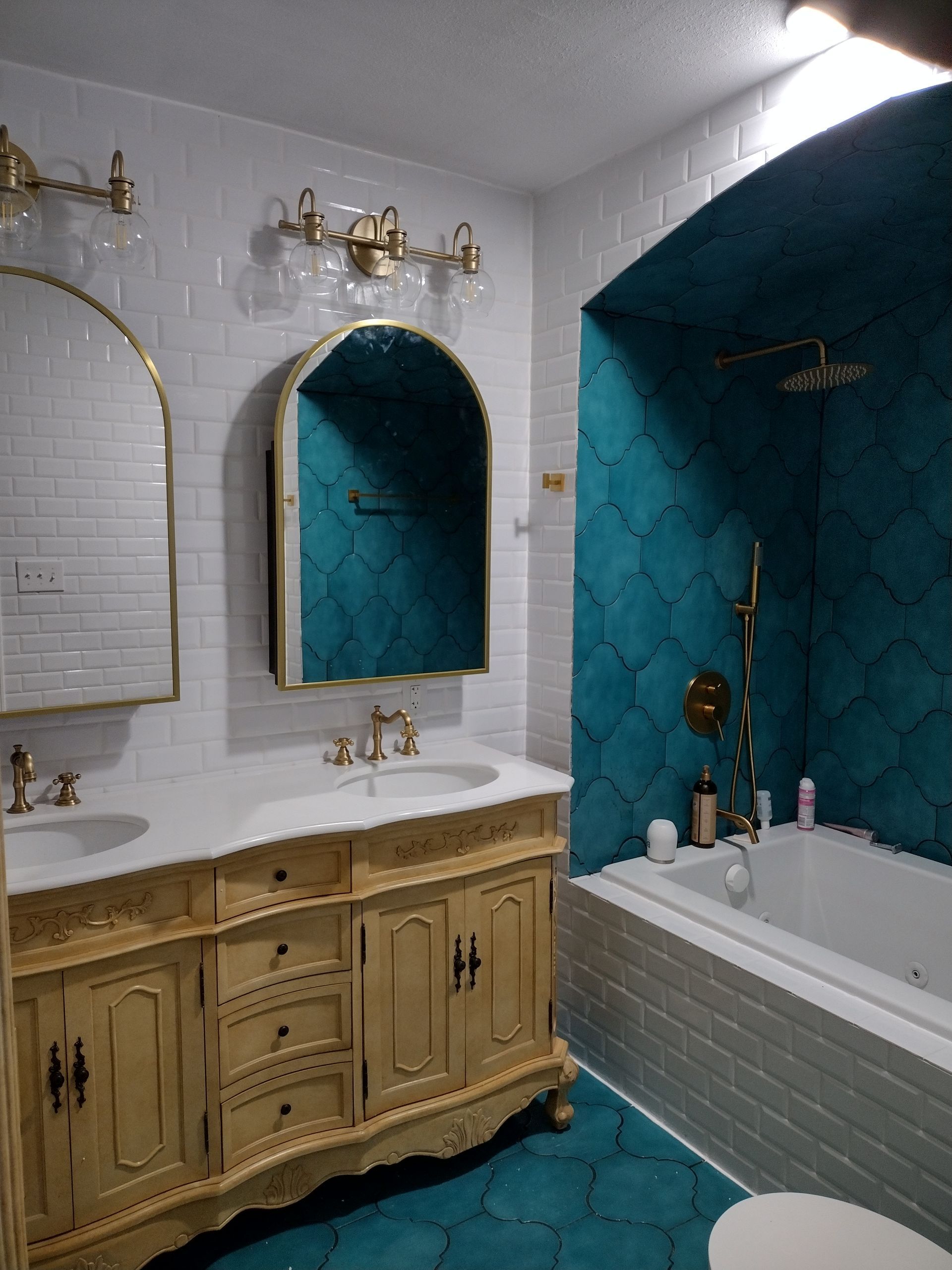Empty room with a window and hanging light fixture. The walls are light colored with a wood frame around the window.