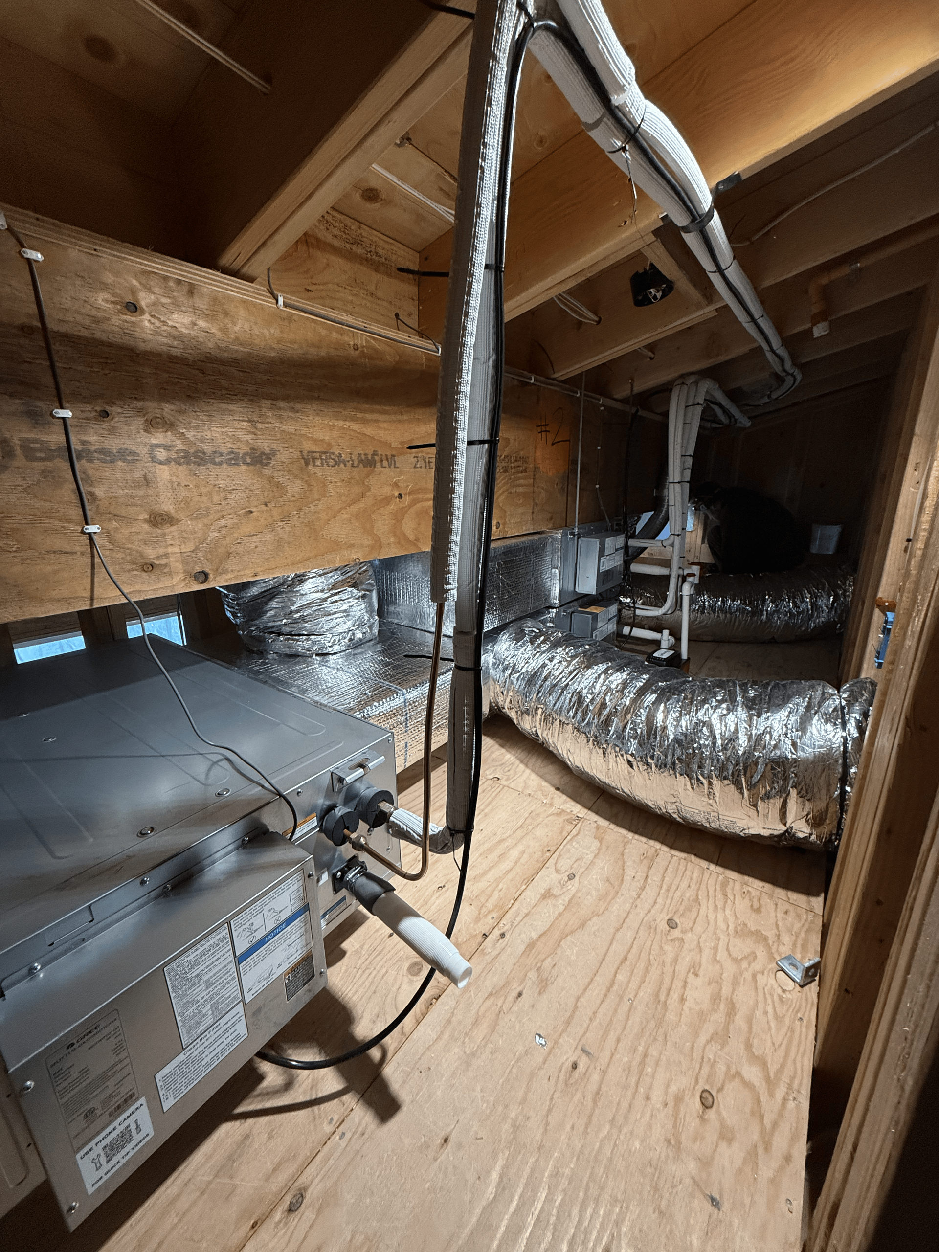 A room with a lot of wires hanging from the ceiling.