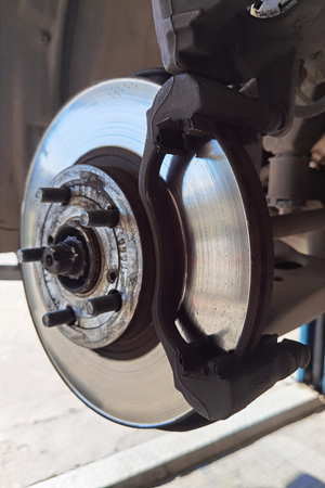 A close up of a brake disc on a car