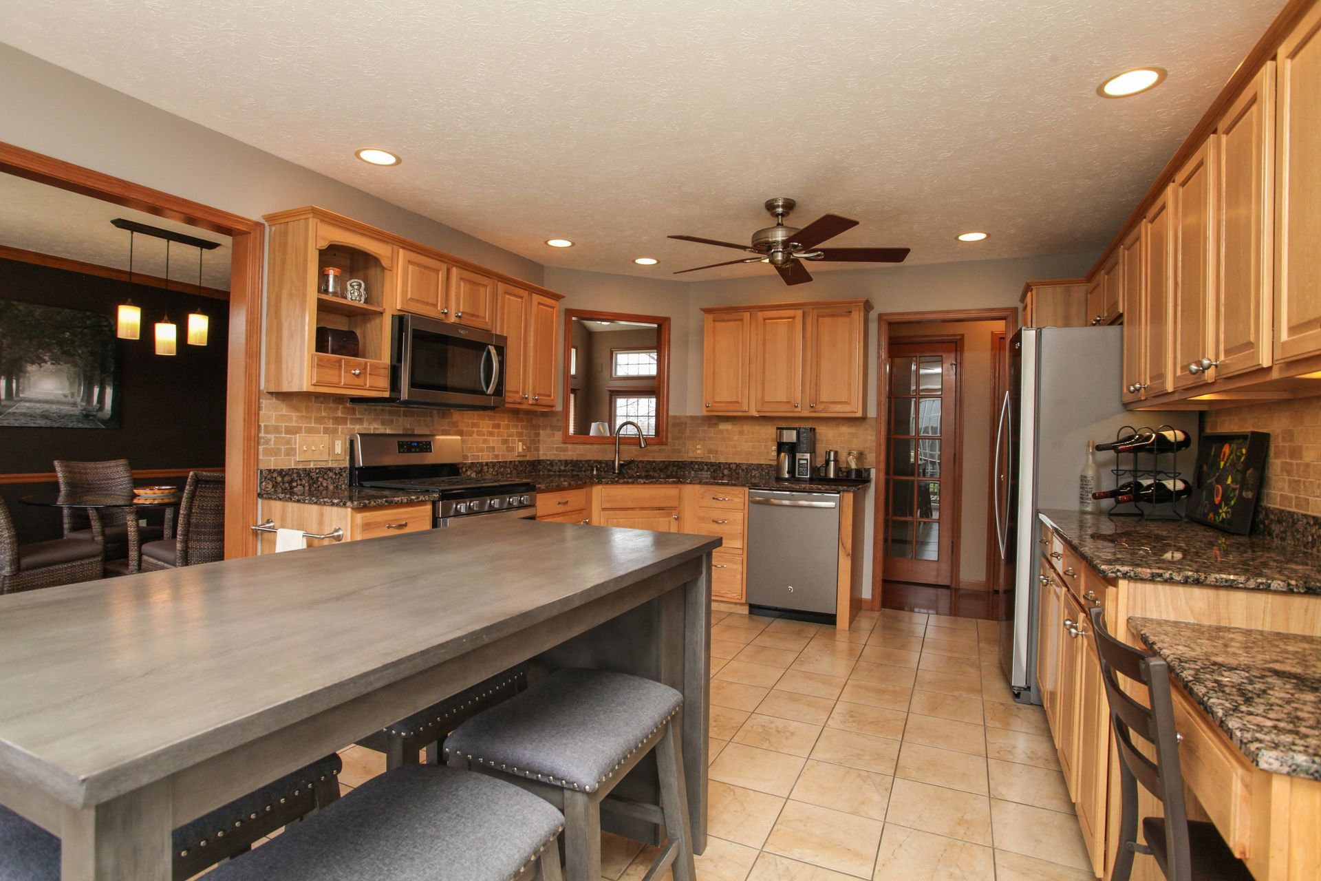 wood cabinet kitchen in a larger home