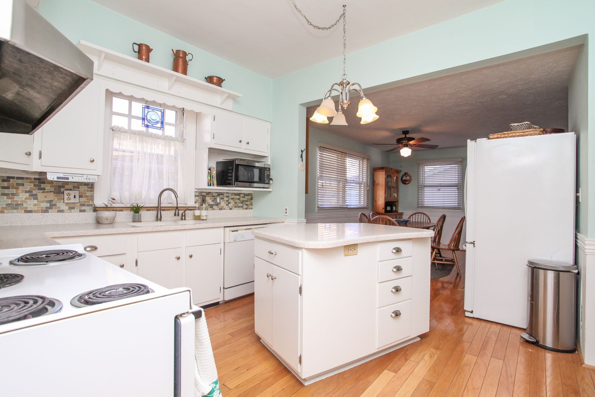 mint colored kitchen with center island