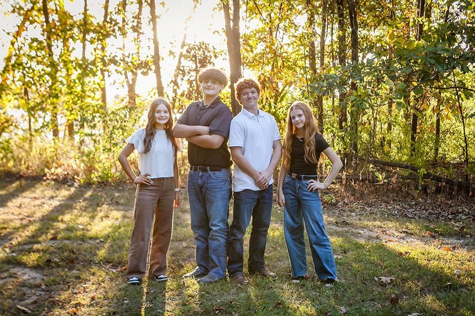 siblings posing by Mazter Mindz Media Bloomington IL Photographer