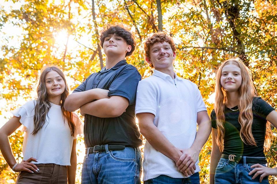 siblings posing by Mazter Mindz Media Bloomington IL Photographer