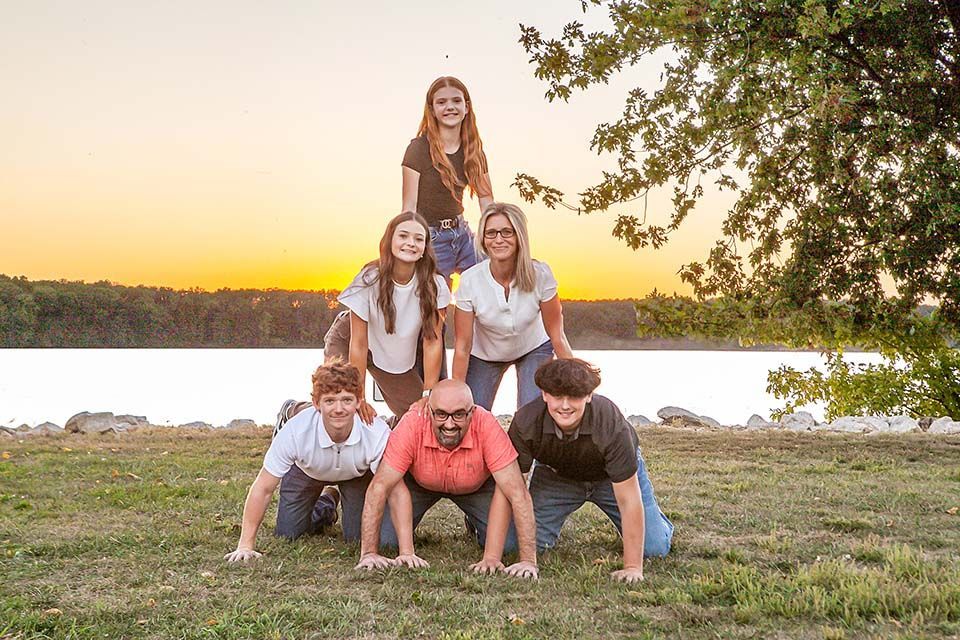 Family doing a pyramid by Mazter Mindz Media Bloomington IL Photographer