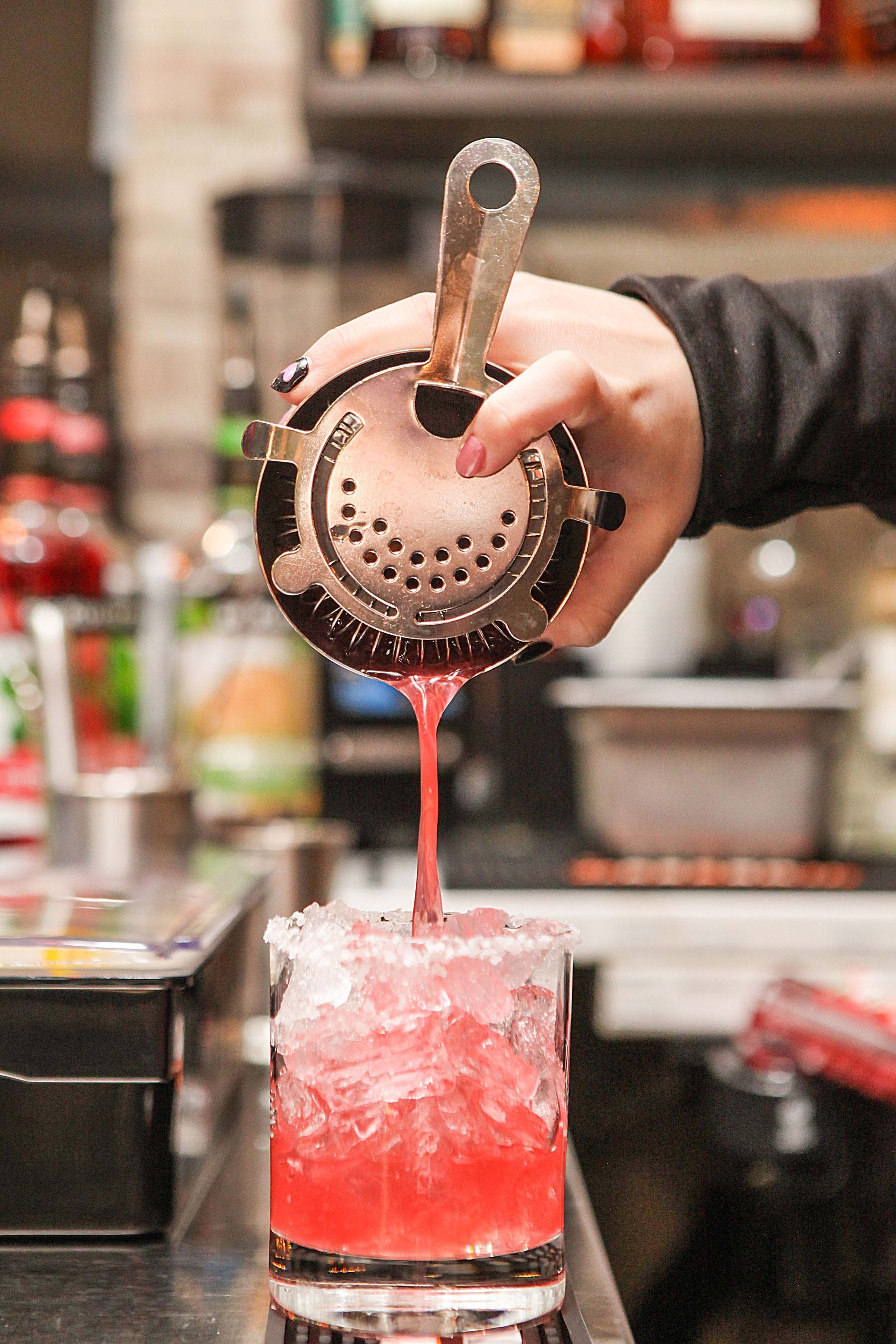 pouring a fruity drink