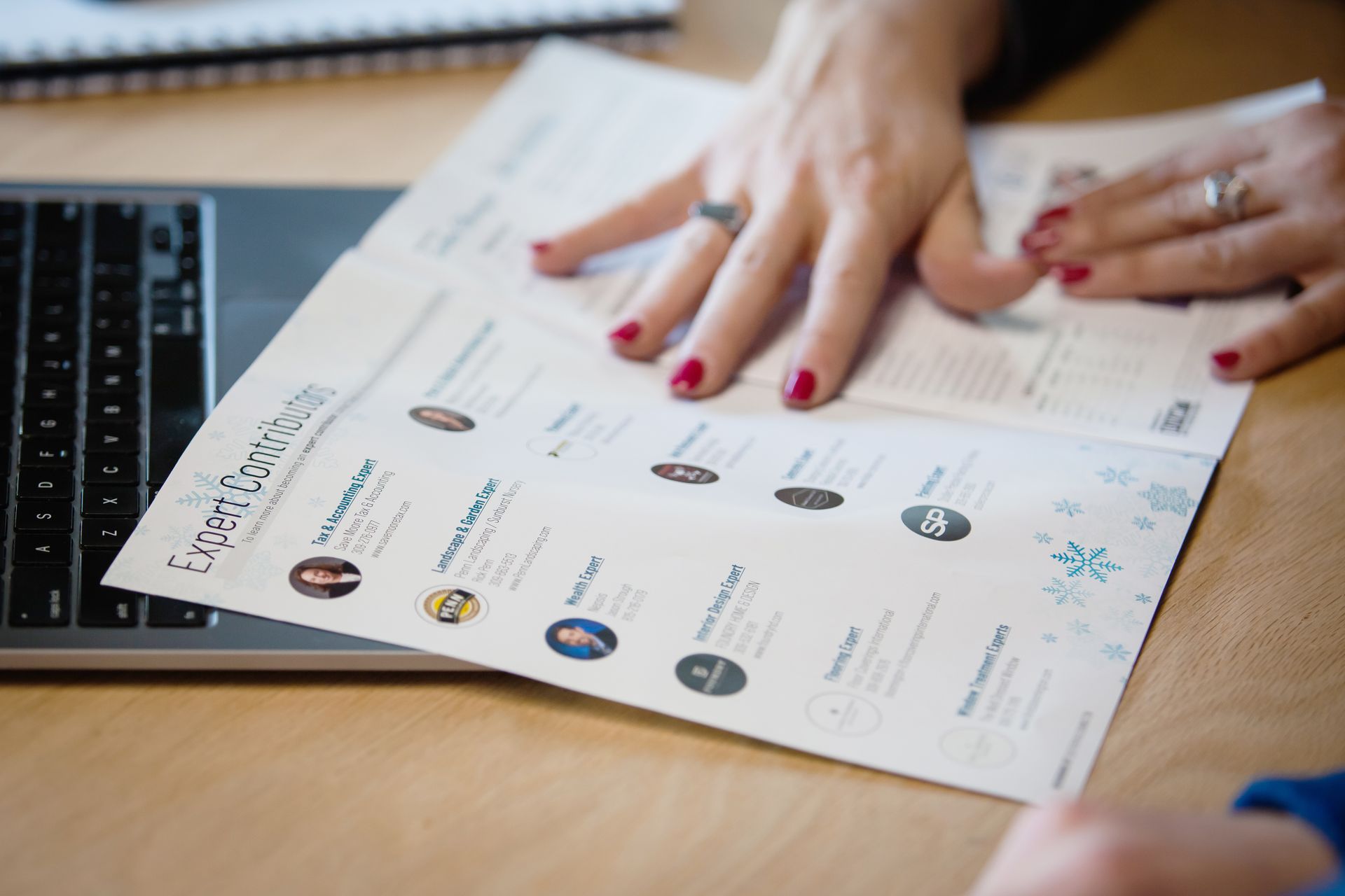 Hands holding a document labeled