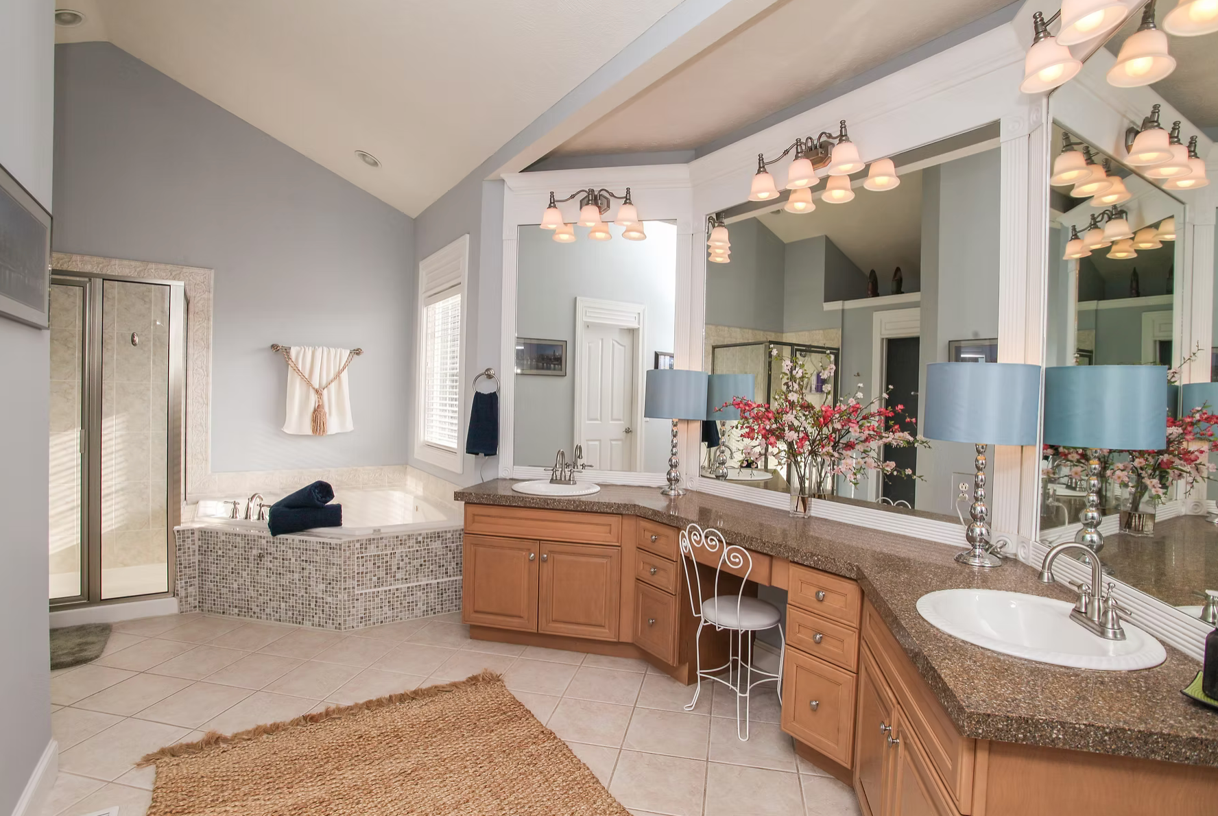 bathroom decorated elegantly with light blues and pinks