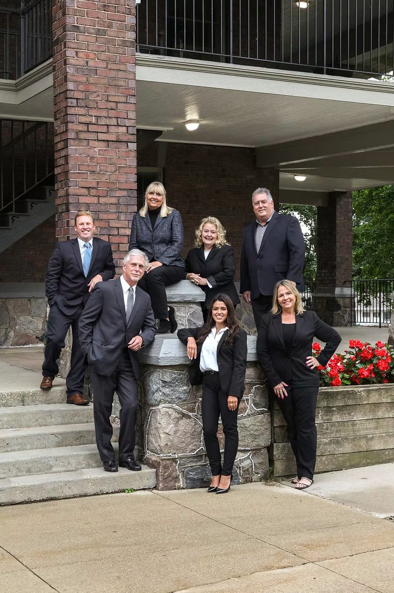 real estate team posed and smiling