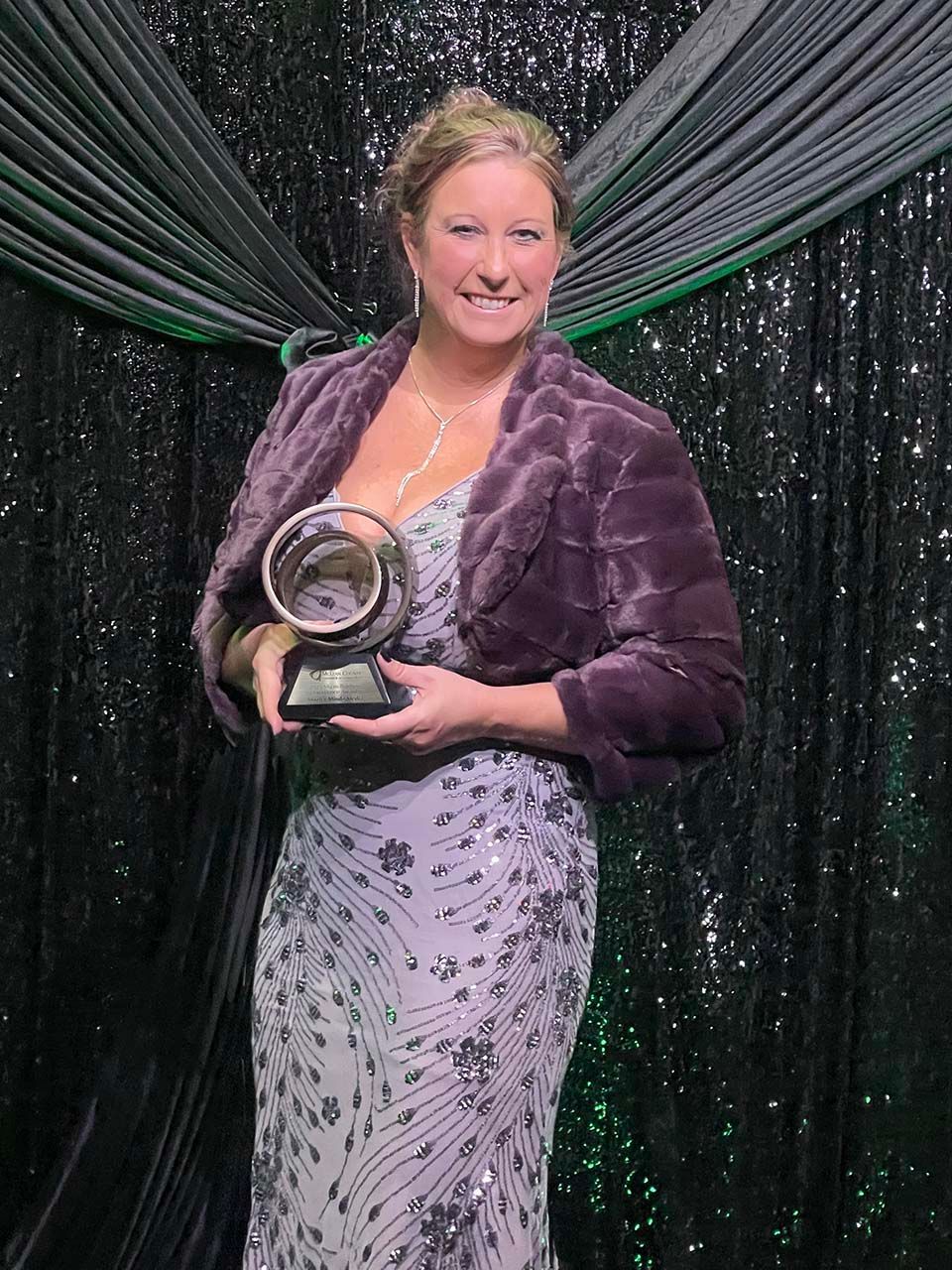 Steph Mazanowski holding her trophy