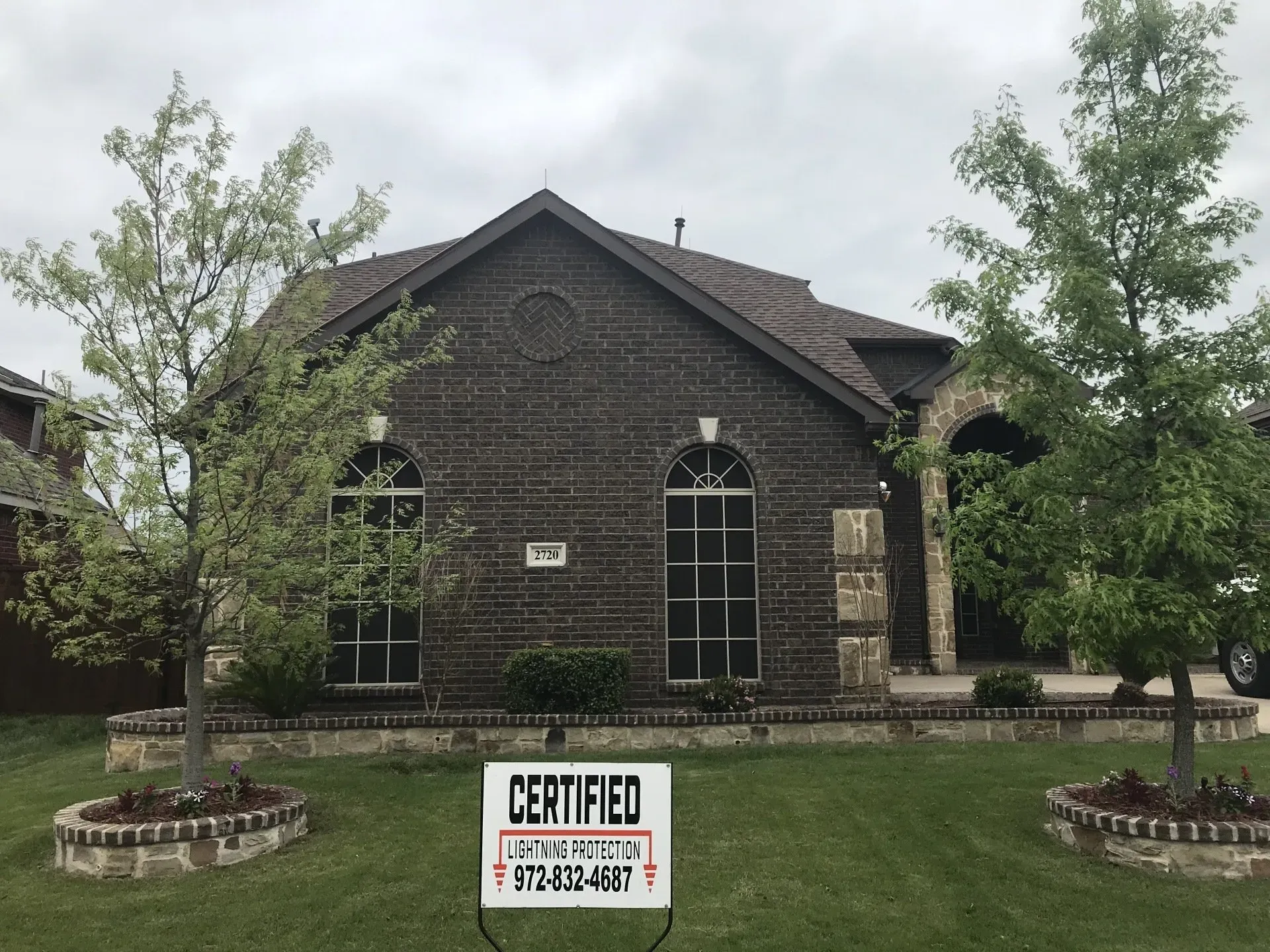 A house with a certified sign in front of it
