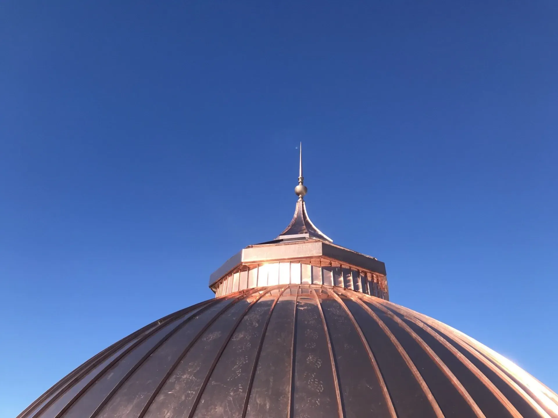 A dome with a blue sky in the background