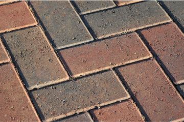 Red and brown block paving driveway.