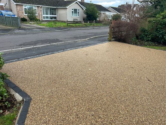 Beige resin driveway in Plymouth