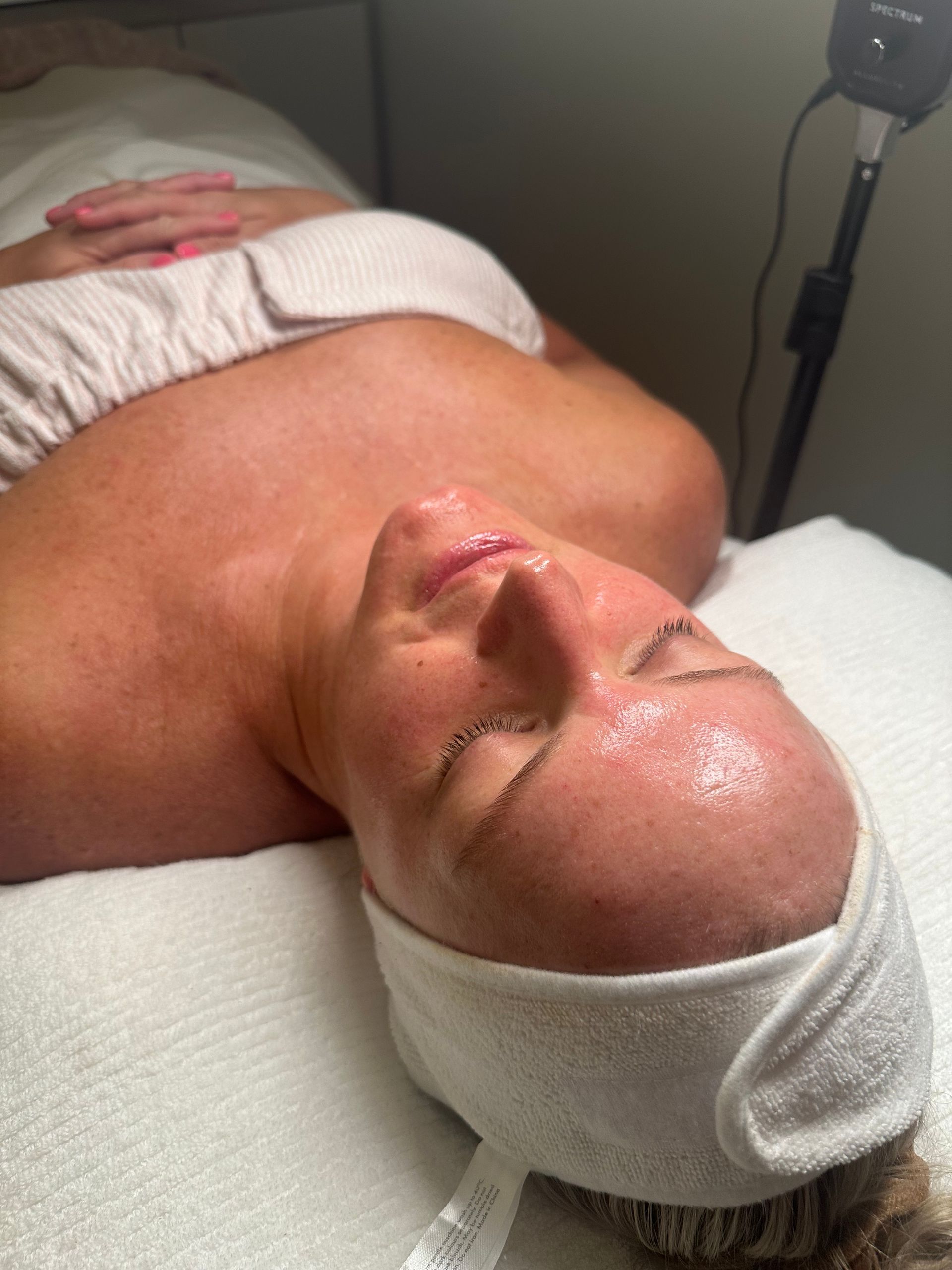 Person Lying Down With a Facial Treatment — Vanity Skin and Beauty Forster in Forster, NSW