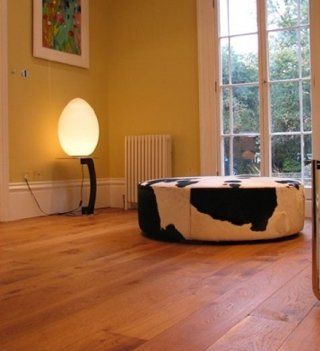 Wide plank wood honey coloured floor