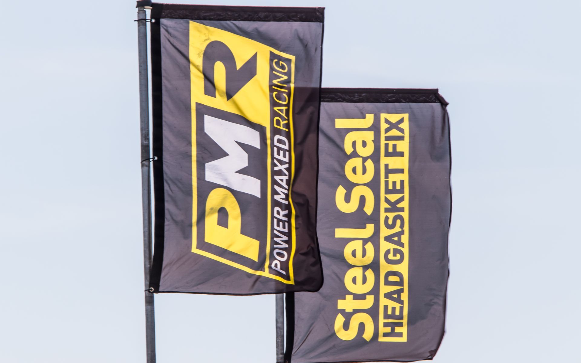 A couple of flags that say steel seal head gasket fix