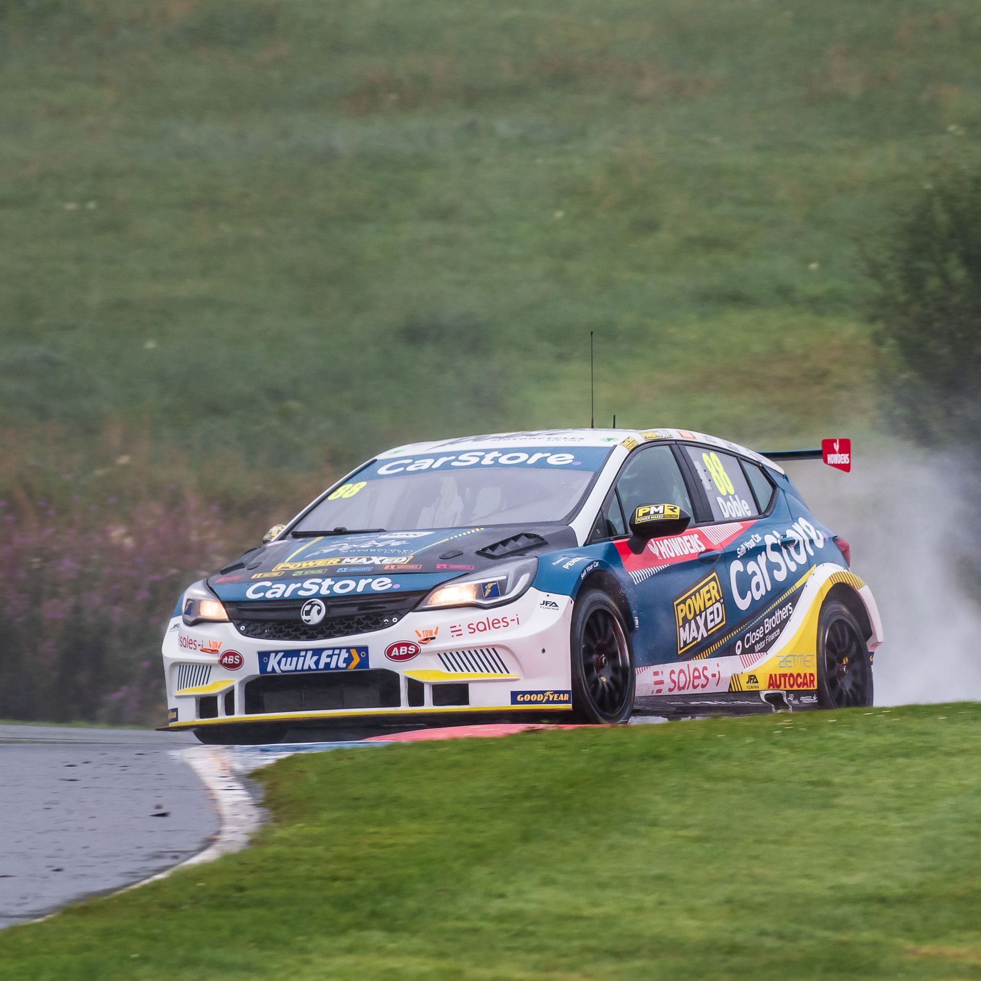 A race car with the word carstore on the front