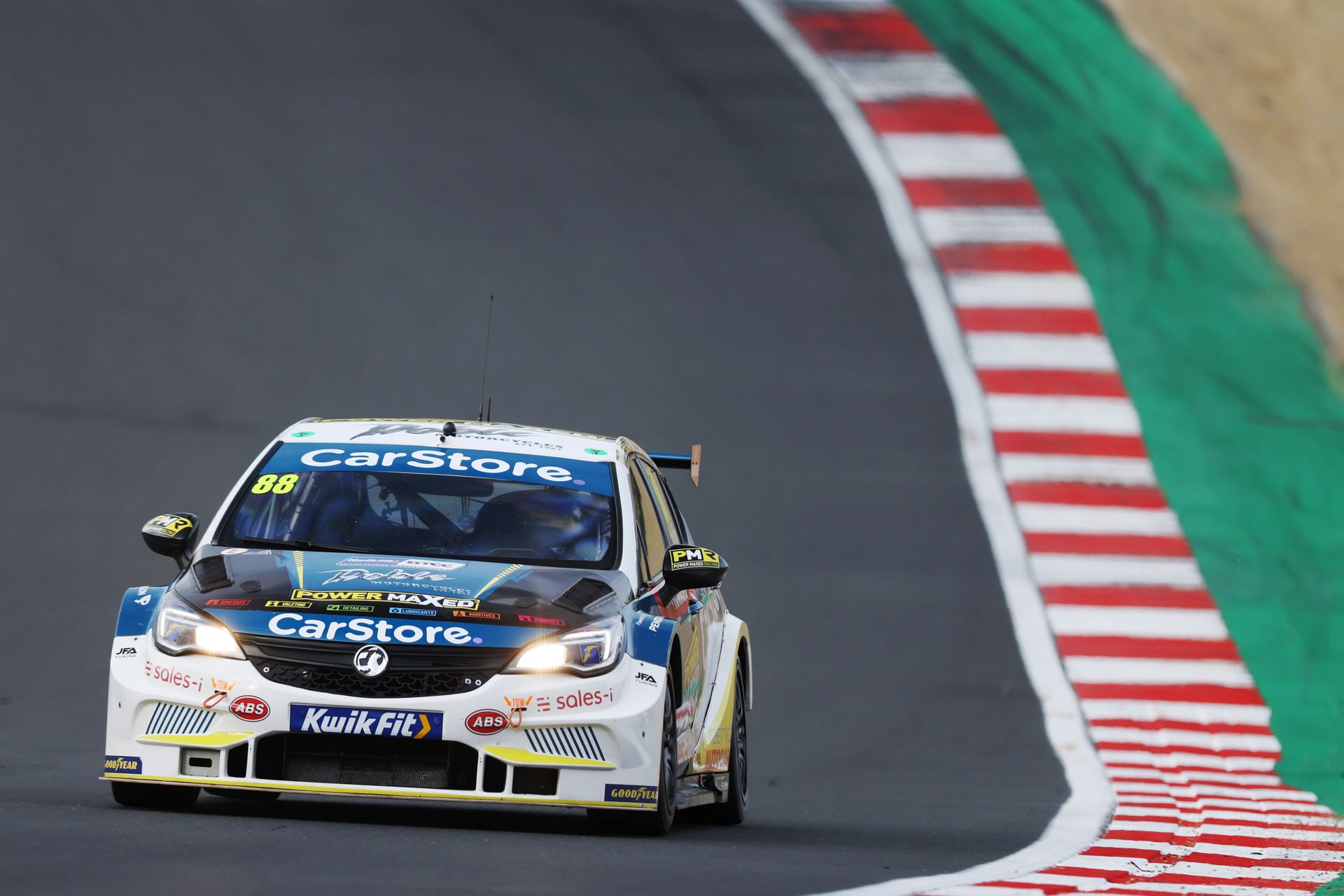 A race car with the word carstore on the front