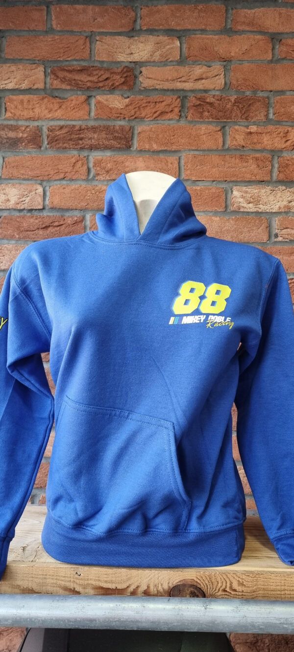 A blue #88ARMY hoodie is on a mannequin in front of a brick wall.