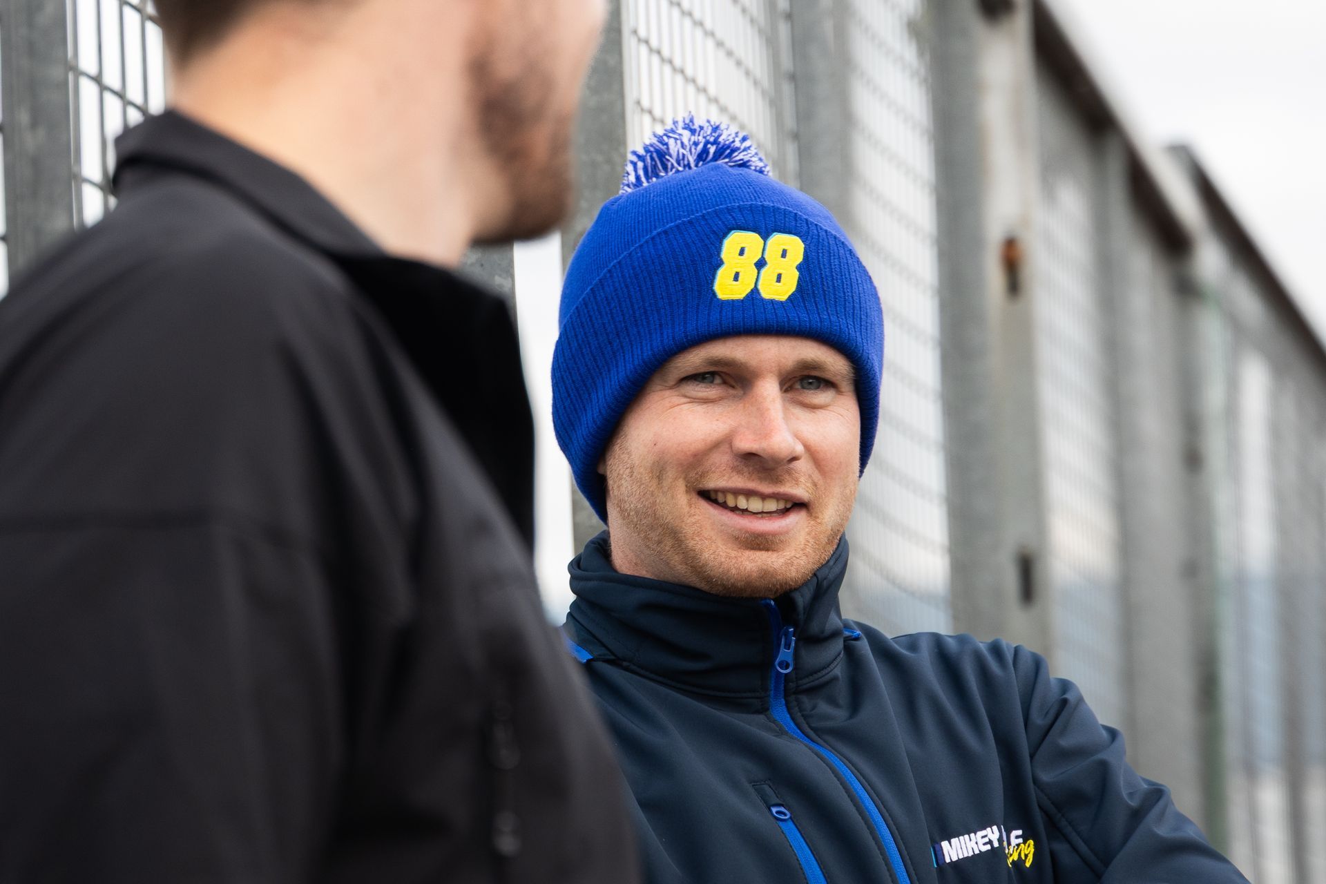 Mikey Doble overlooking Donington Park Circuit whilst wearing #88ARMY beanie