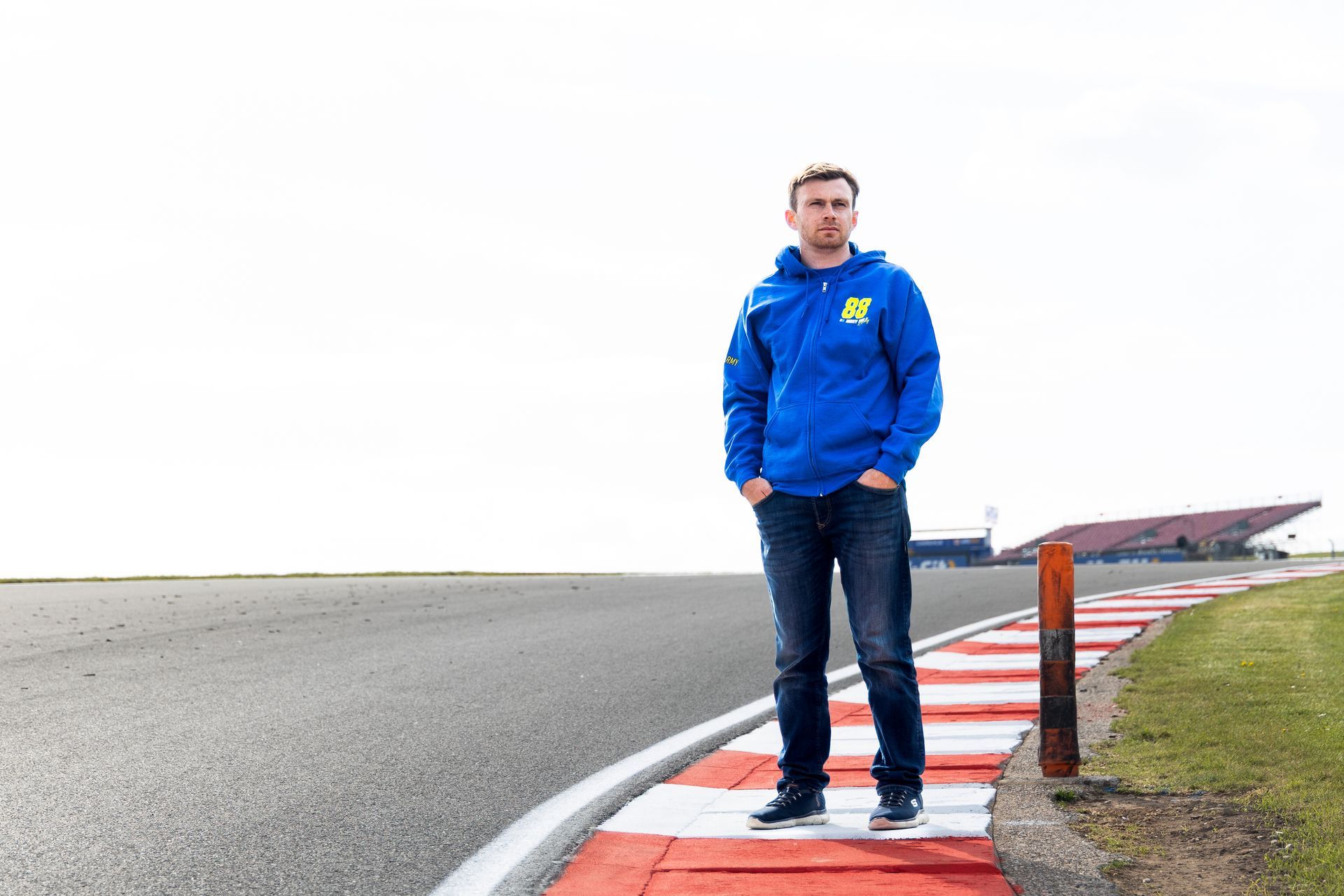 Mikey Doble wearing #88ARMY Zip Hoodie on corner at Donington Park