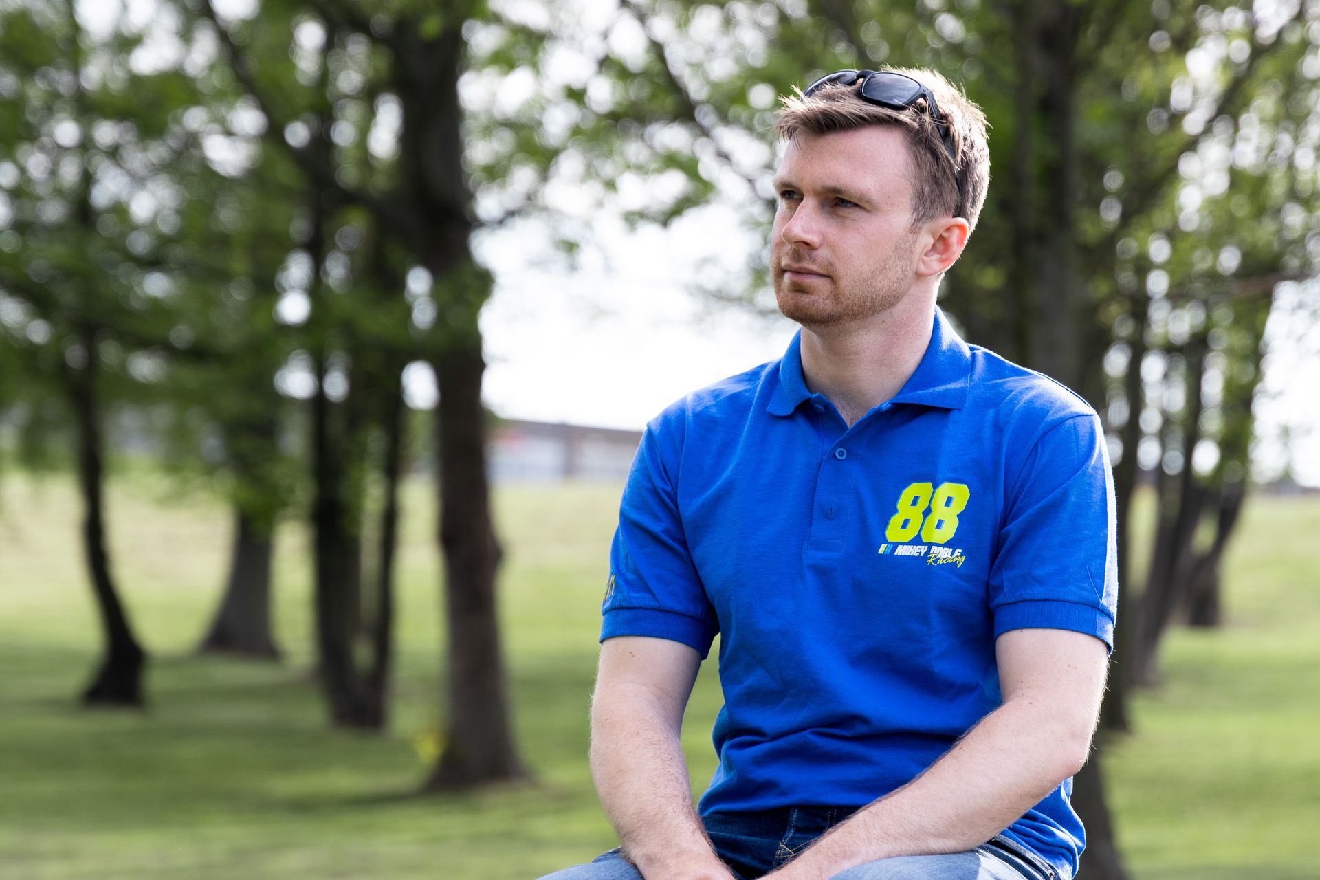 Mikey Doble modelling #88ARMY polo shirt at Donington Park circuit