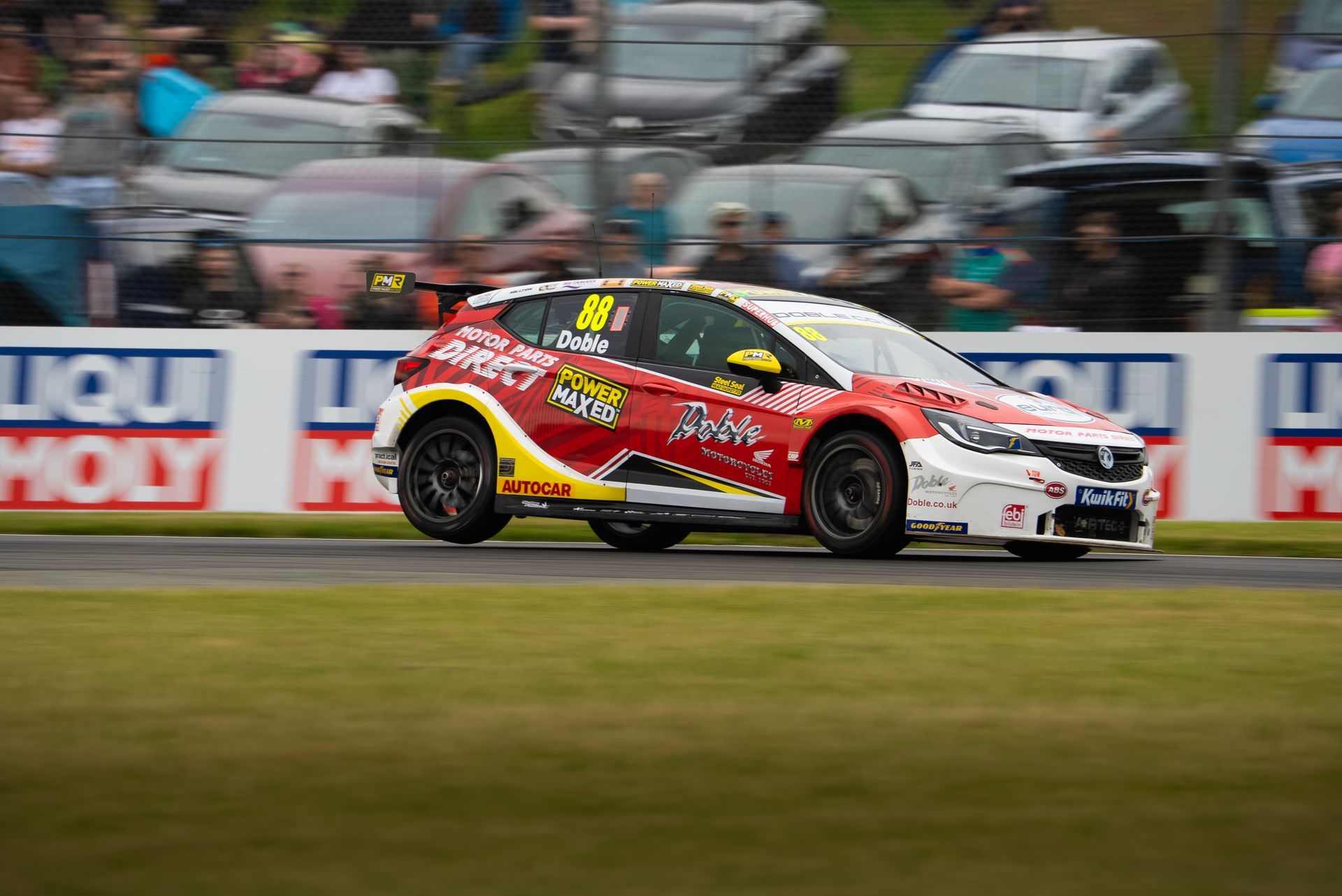 Mikey Doble fully sending it with tyre off of ground at Oulton Park 2025 BTCC