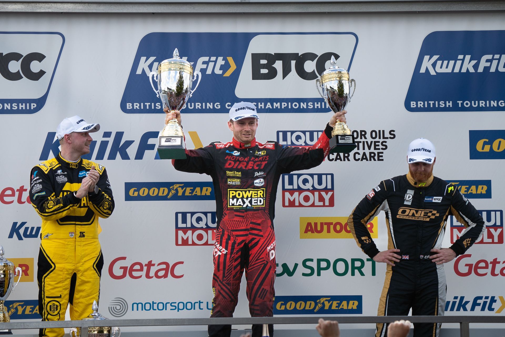 Mikey Doble lifting trophies on Snetterton 2025 BTCC Podium