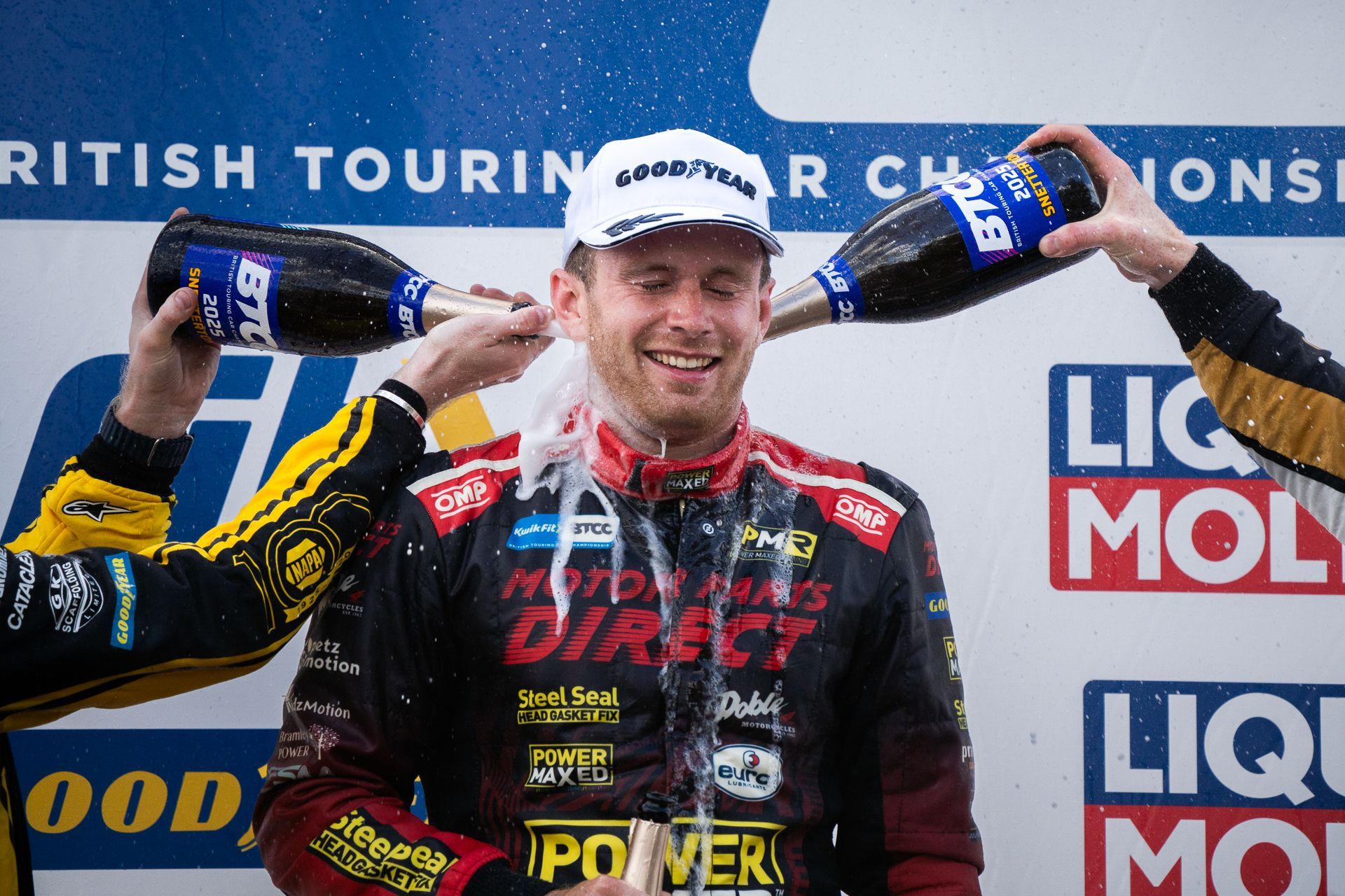 Mikey Doble getting drenched in champagne at Snetterton BTCC 2025 after winning race