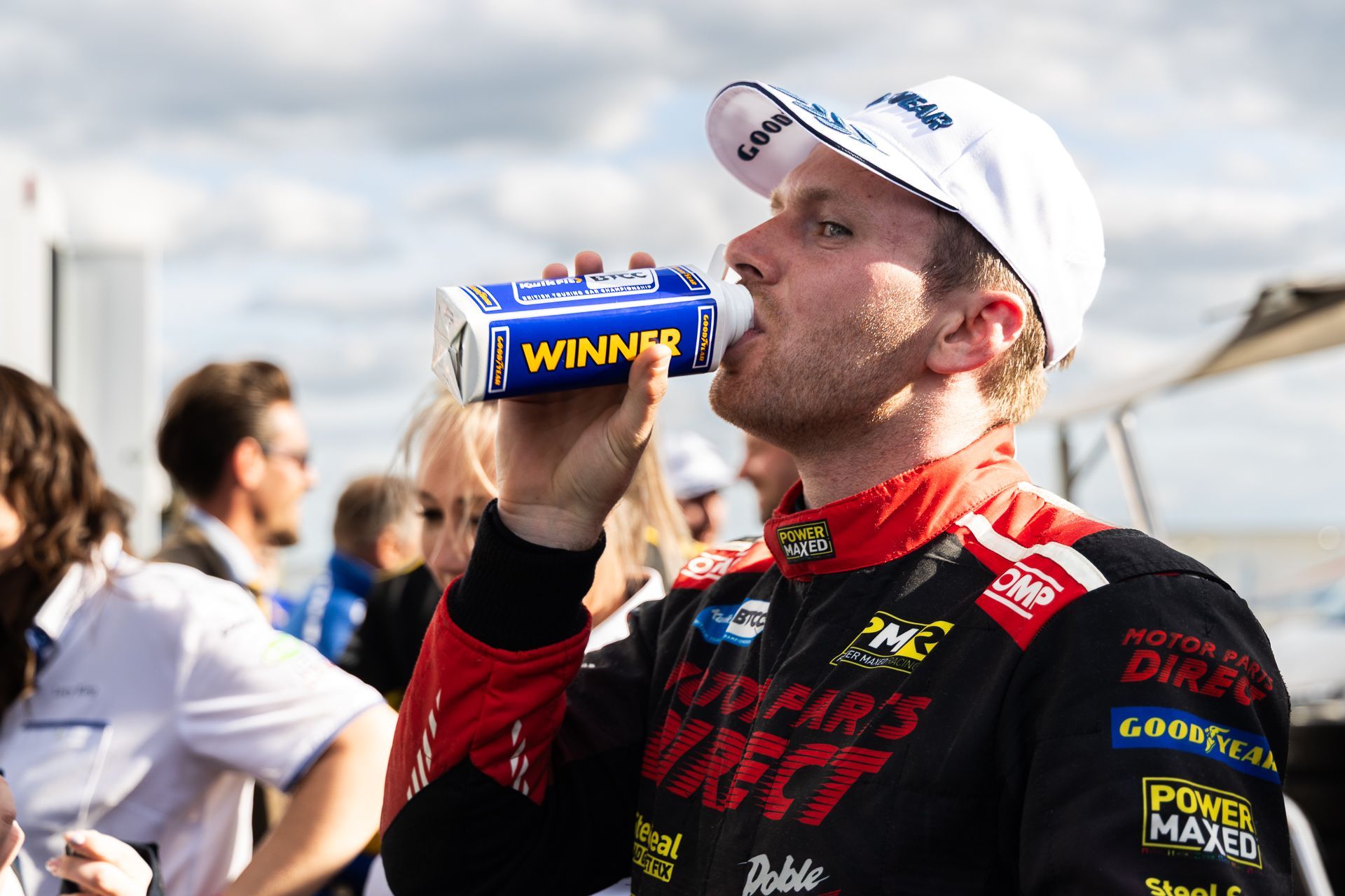 Mikey drinking from Winner's bottle at Snetterton 2025 after winning race