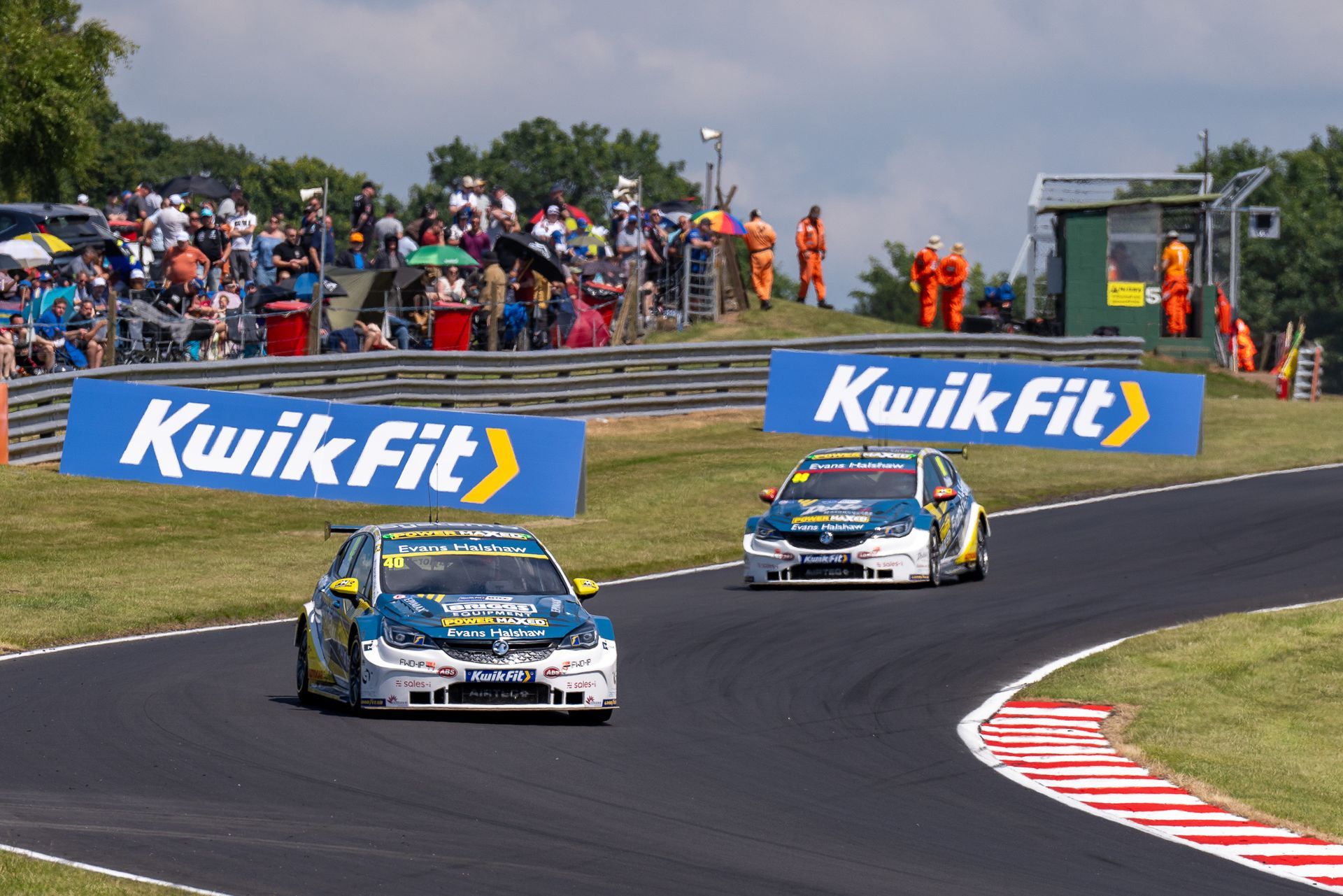 A race track with kwik fit signs on the side