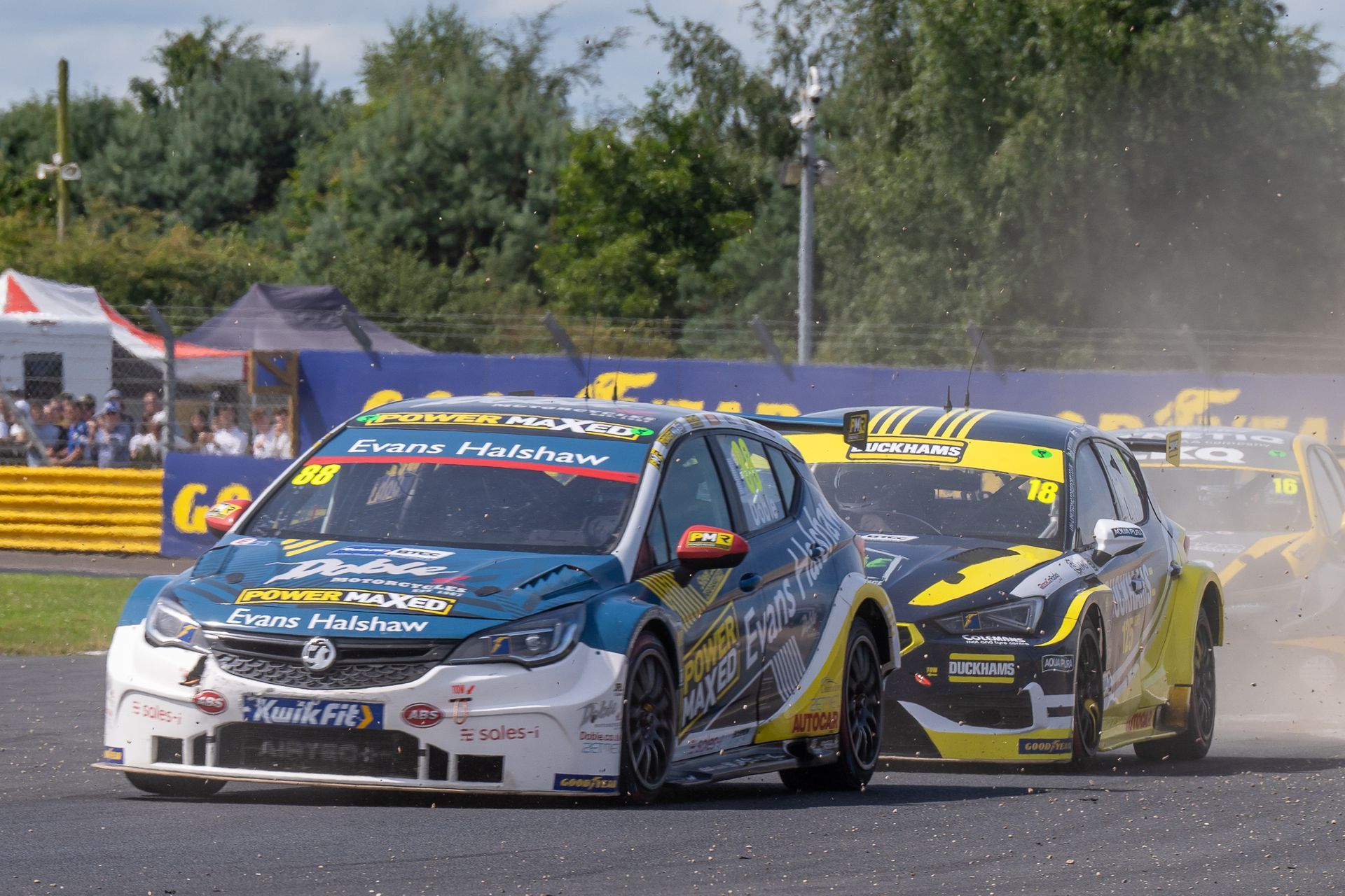 A group of racing cars are racing on a track.