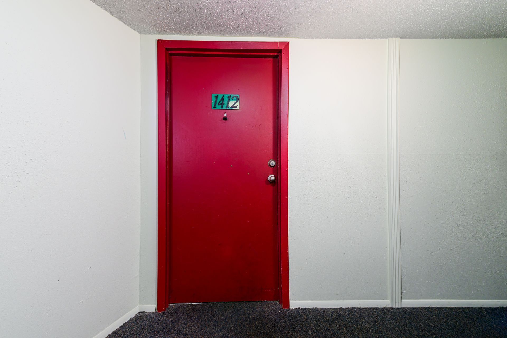 A red door with the number 14 on it